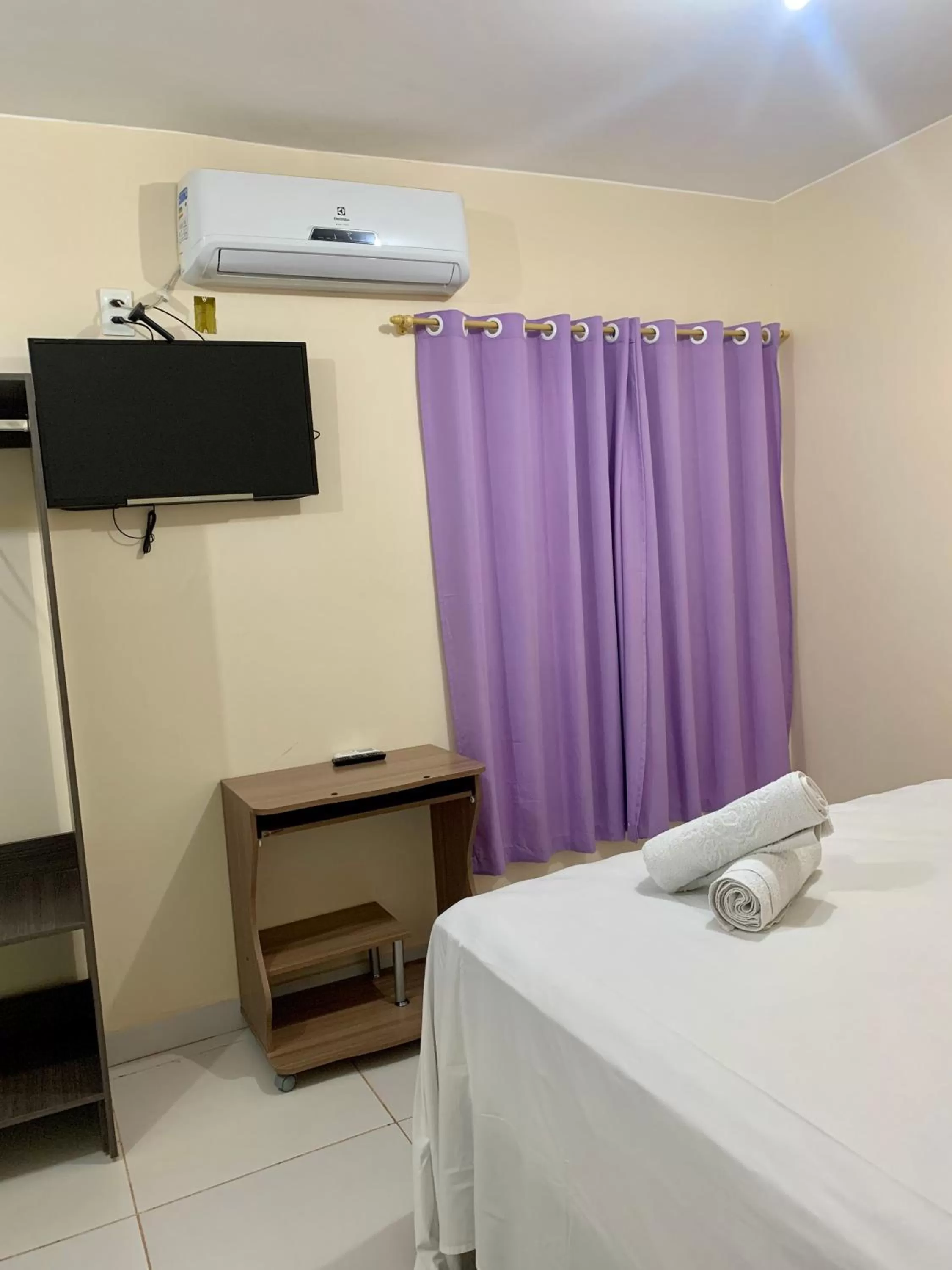 Bed in Pousada Jardim Brasília