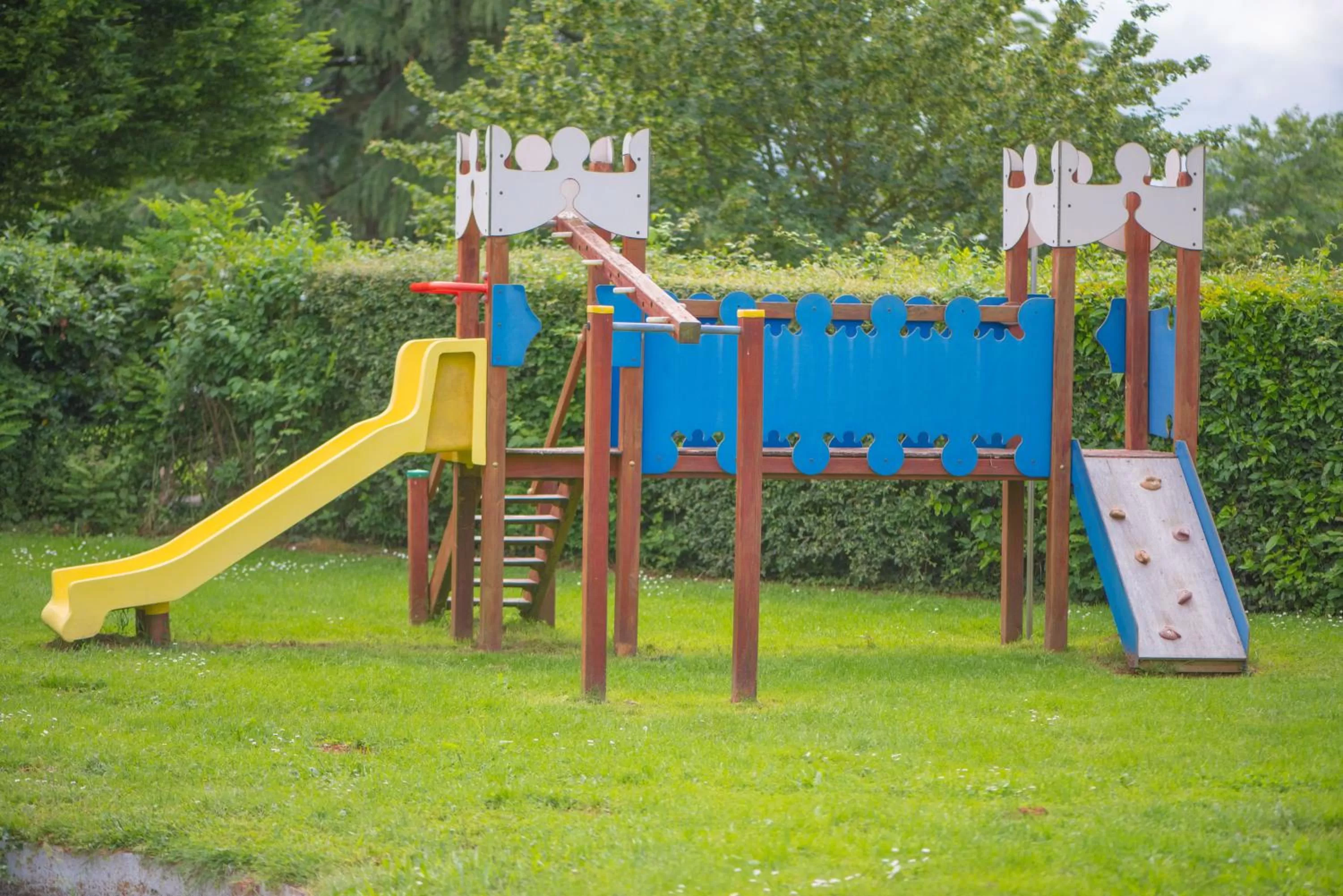 Children play ground in Logis Hôtel Domaine du Moulin Cavier - Restaurants & Spa