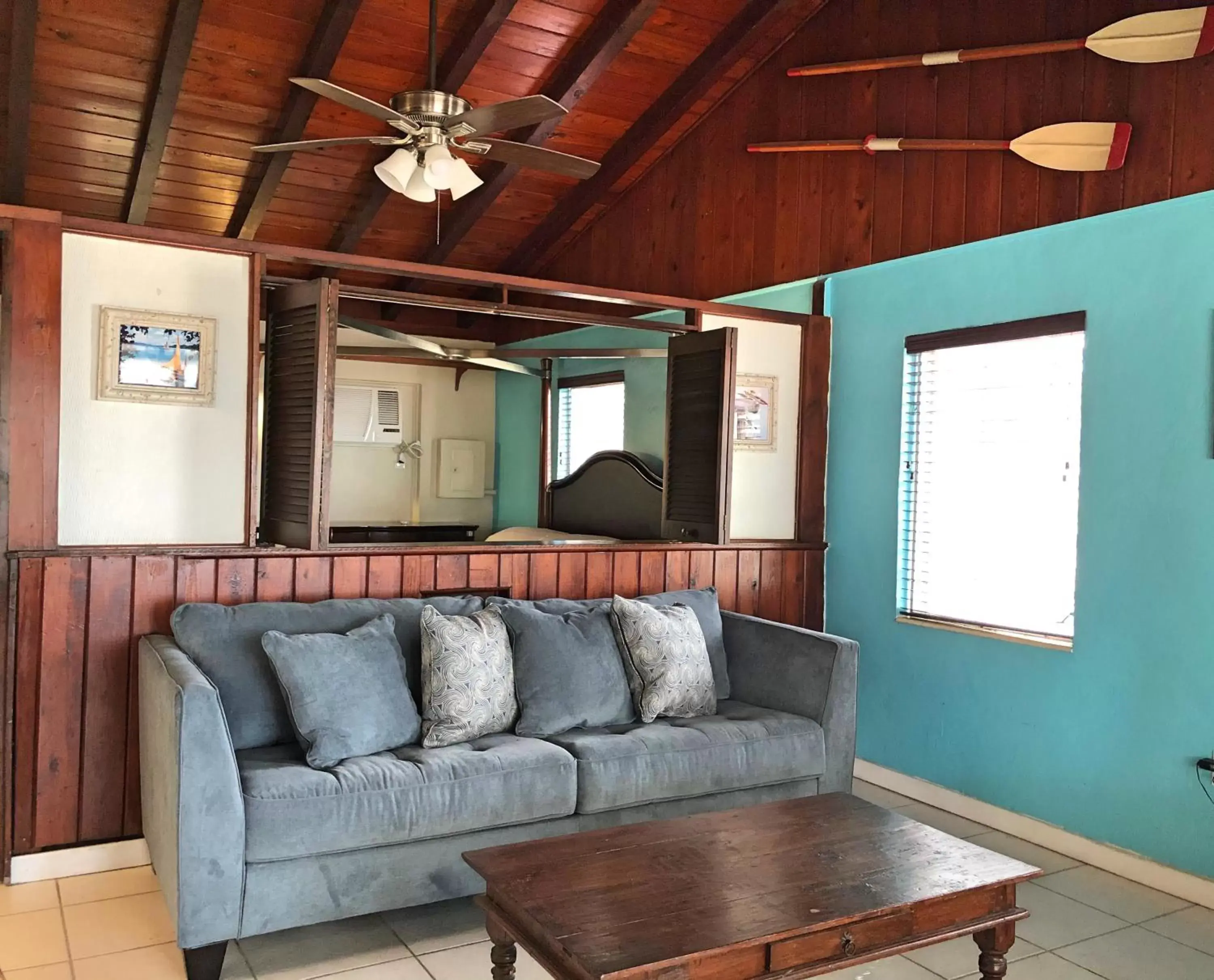 Bed, Seating Area in The Pelican Key Largo Cottages