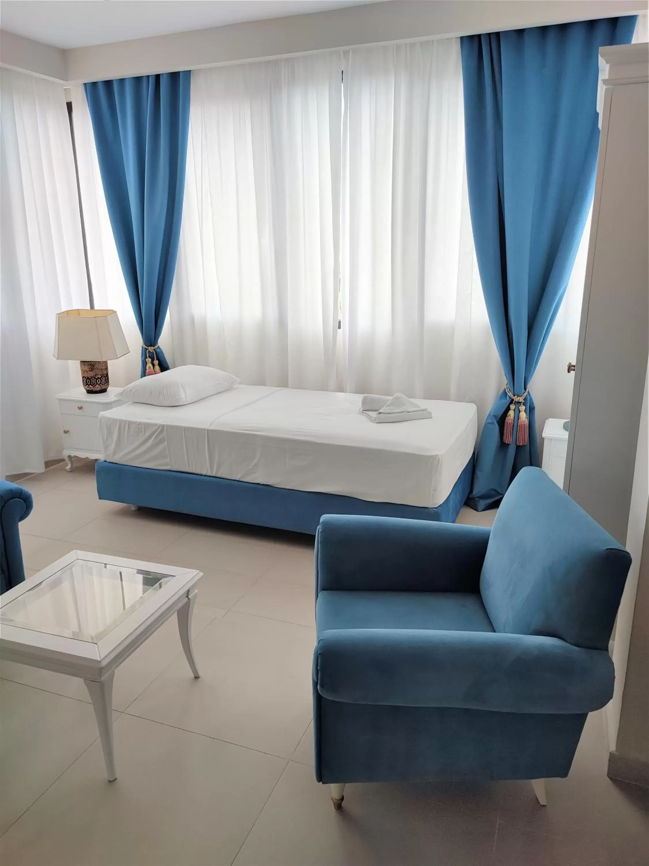 Photo of the whole room, Bed in Light Blue Hotel