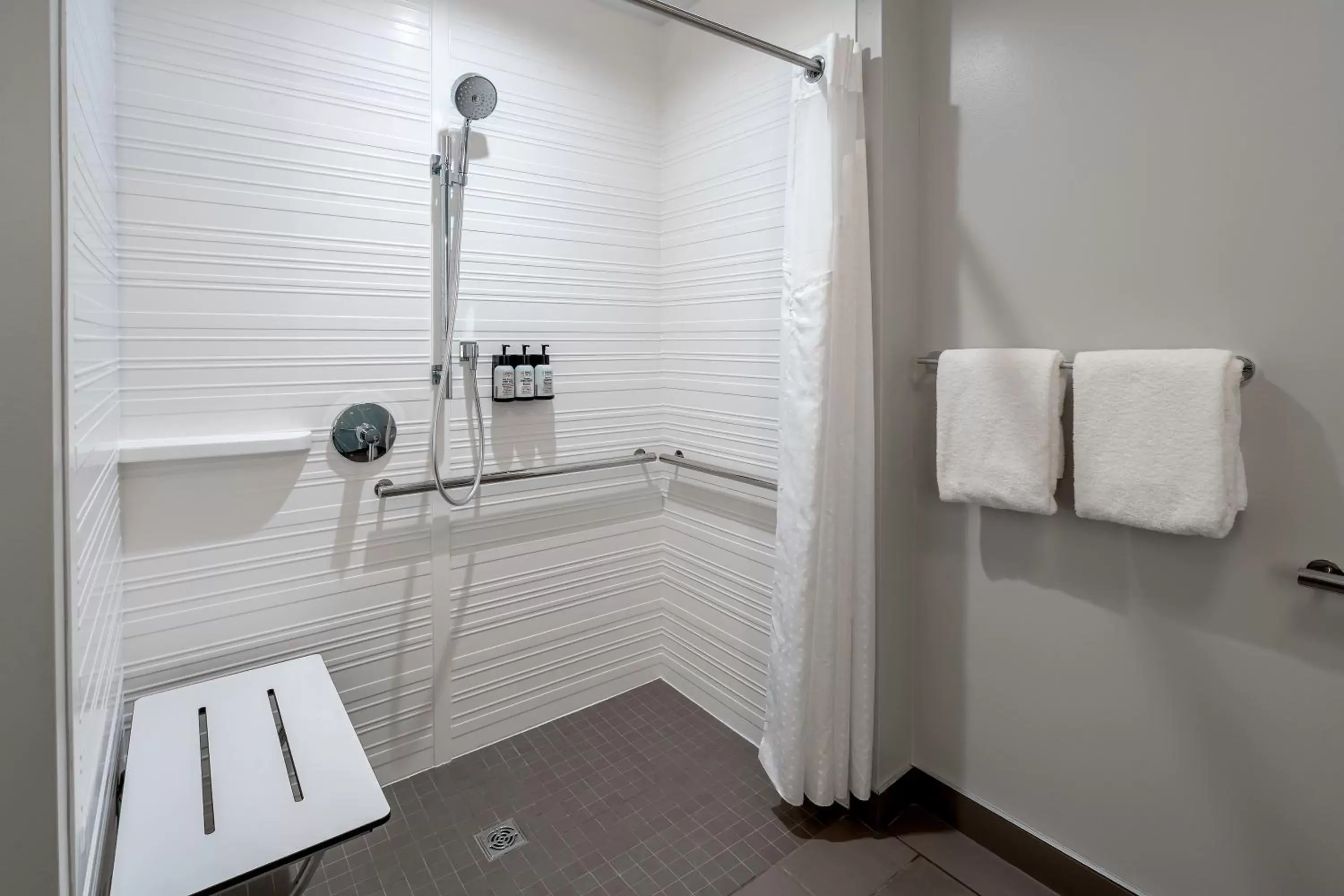 Bathroom in avid hotels Milwaukee West - Waukesha, an IHG Hotel