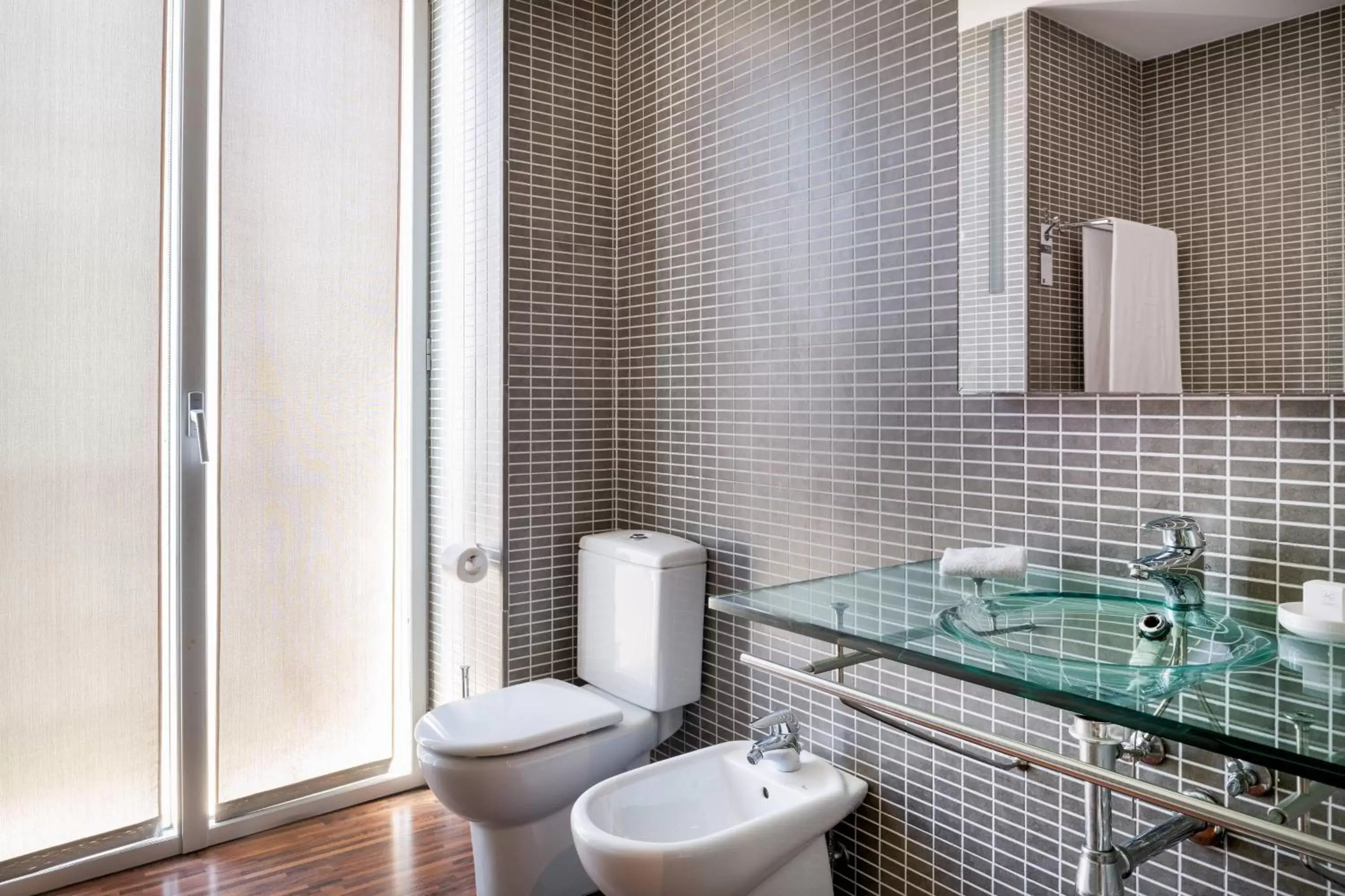 Bathroom in AC Hotel Palacio Universal by Marriott