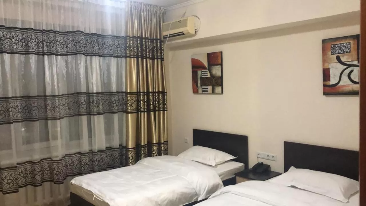 Bed in Altai Business Hotel