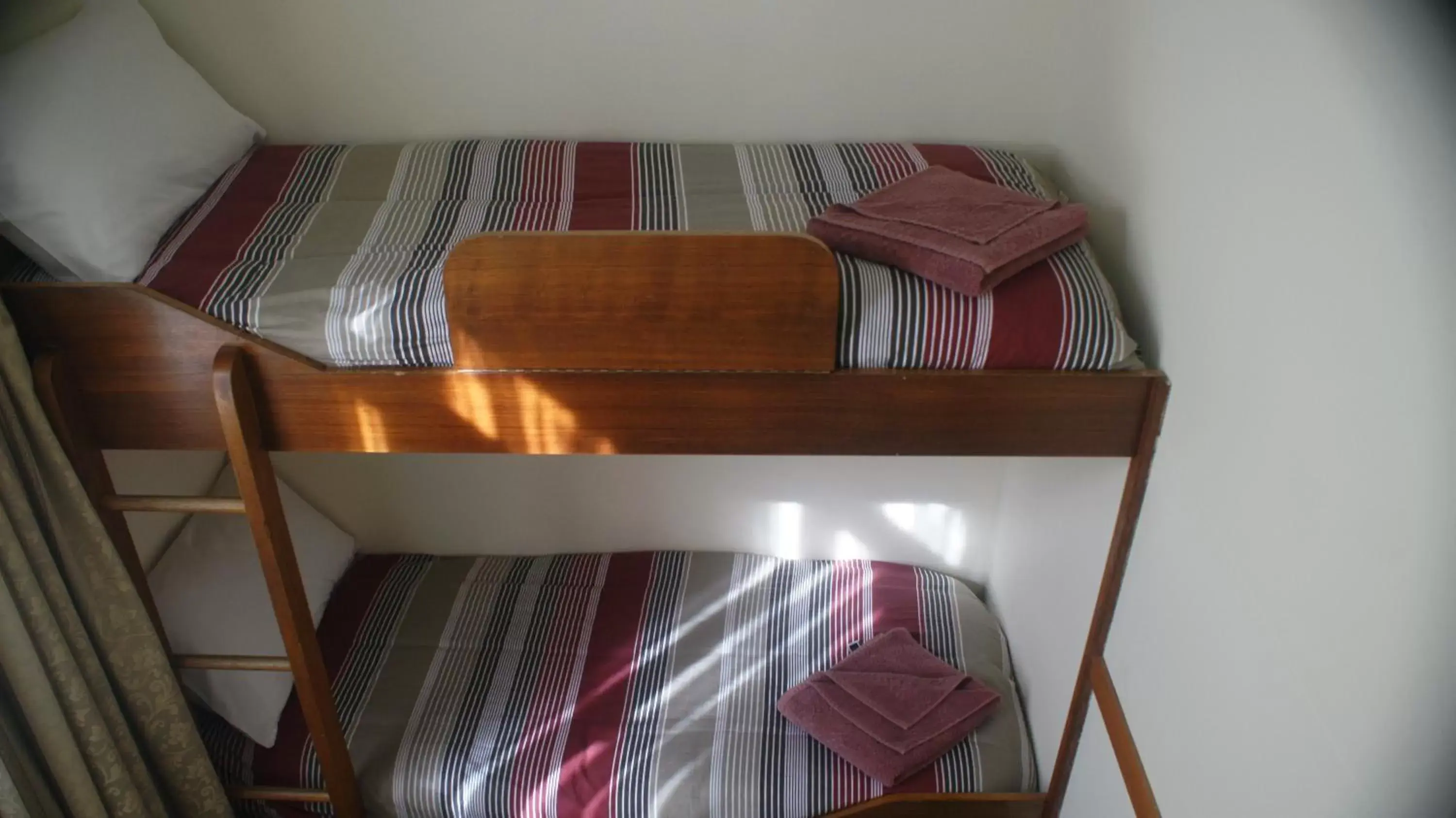 Bed, Seating Area in Three Explorers Motel