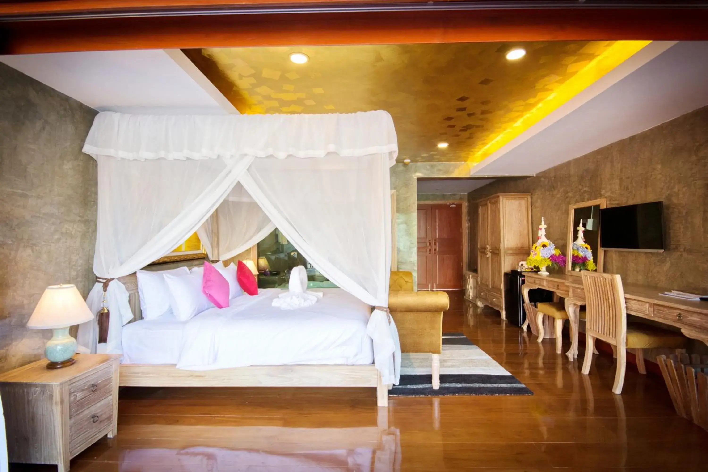 Bed in The Chaya Resort and Spa