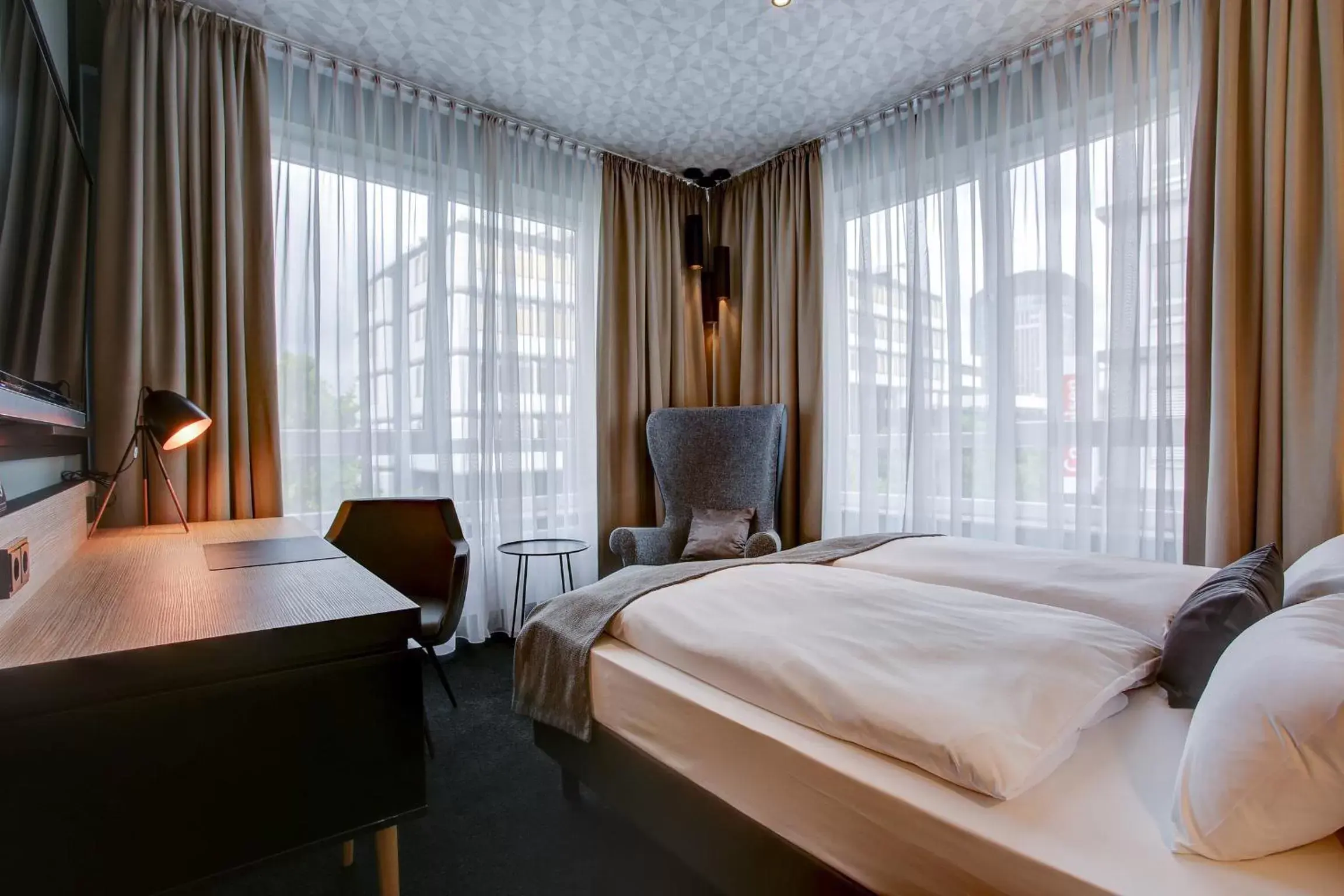 Photo of the whole room, Bed in NYCE Hotel Dortmund City