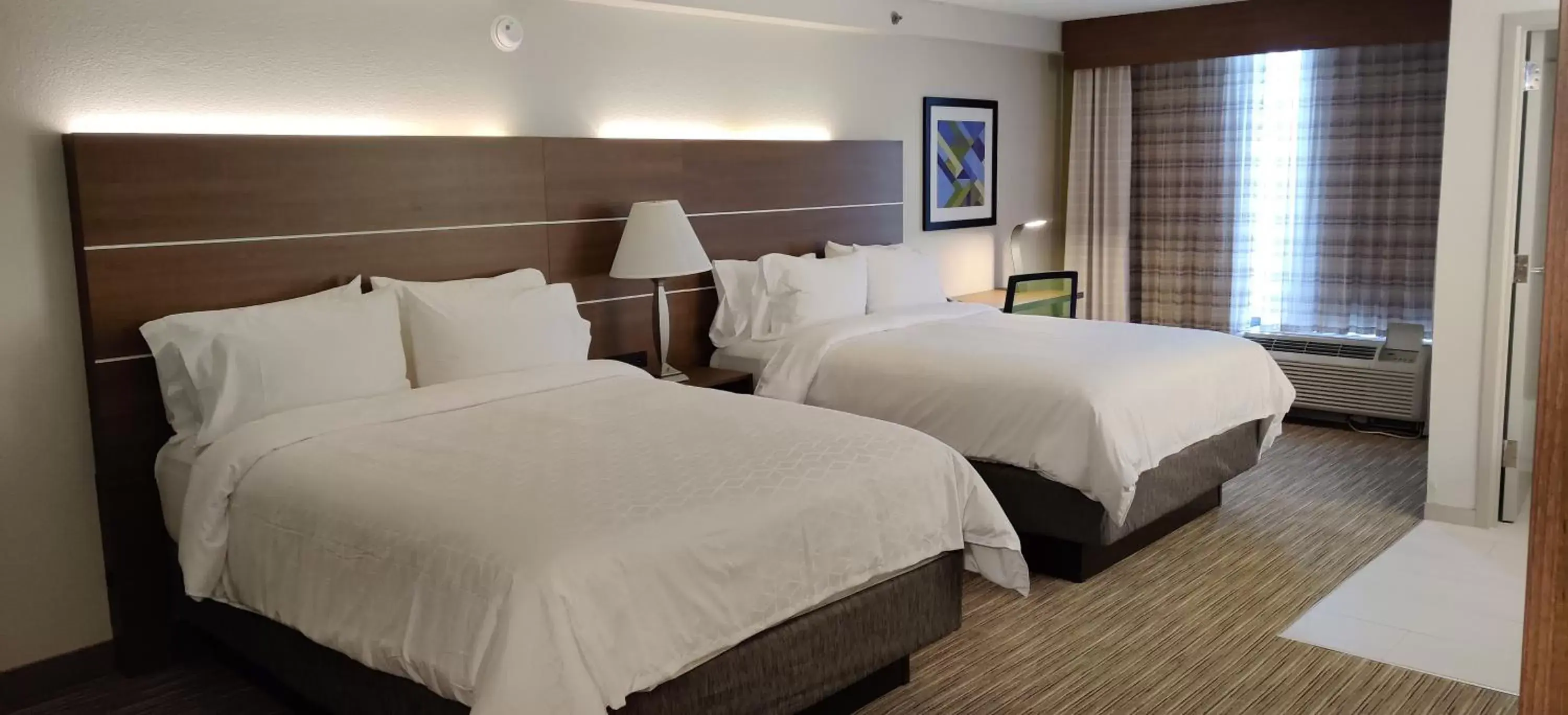 Bed in Holiday Inn Express Hotel & Suites Dallas Fort Worth Airport South, an IHG Hotel