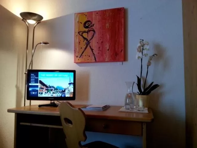 Photo of the whole room, TV/Entertainment Center in Sonnegg Hotel