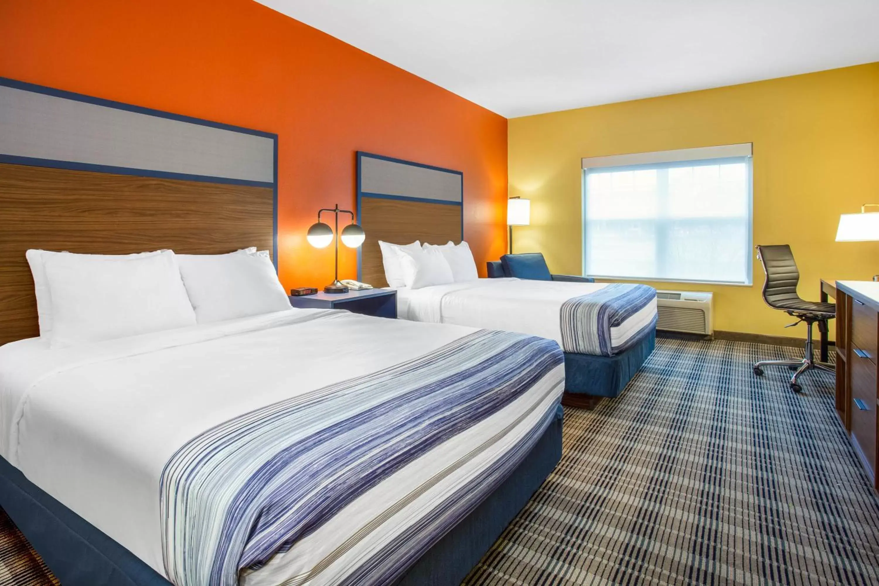 Bed in AmericInn by Wyndham Fulton Clinton