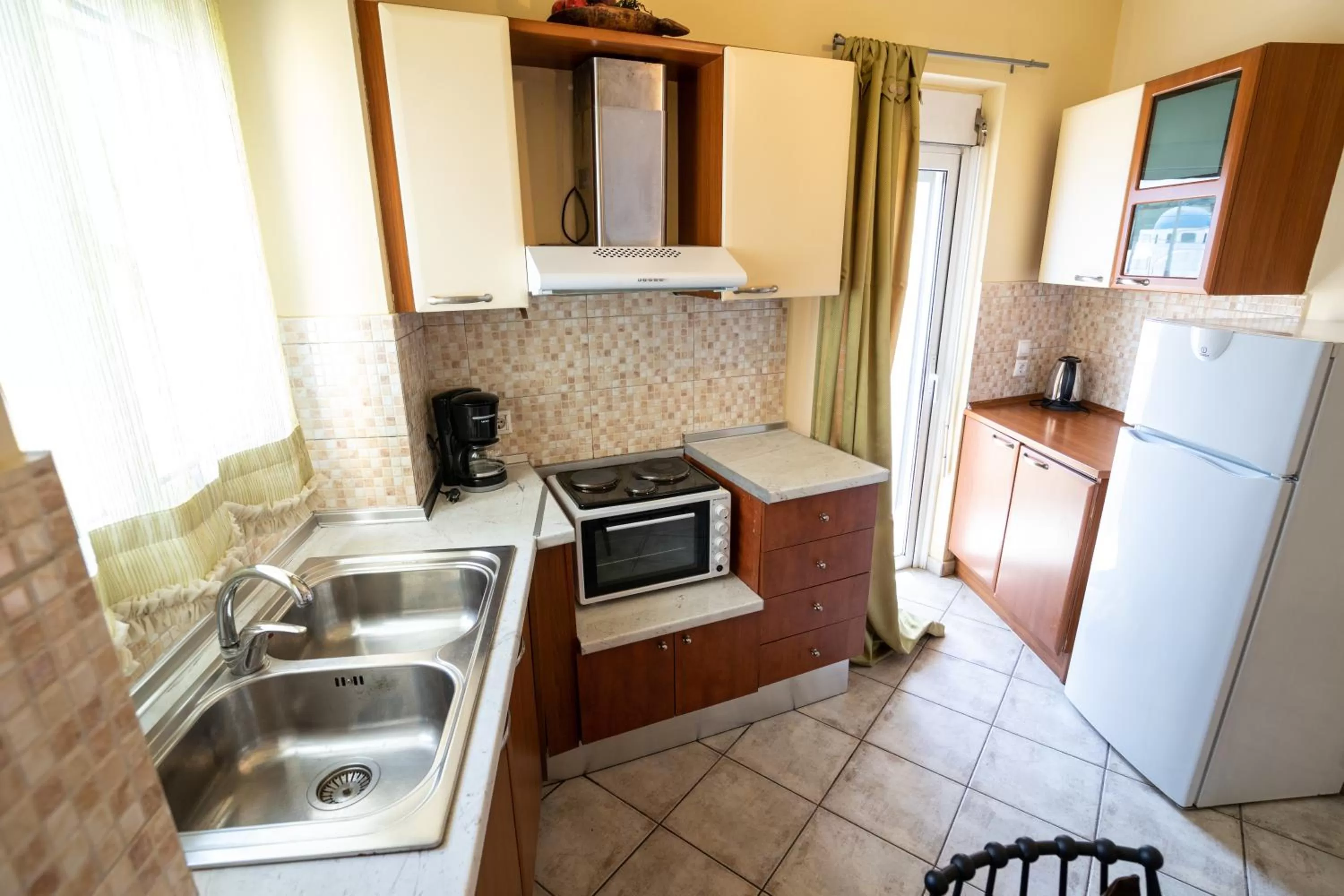 Kitchen or kitchenette in Votsalakia Hotel & Luxury Apartments