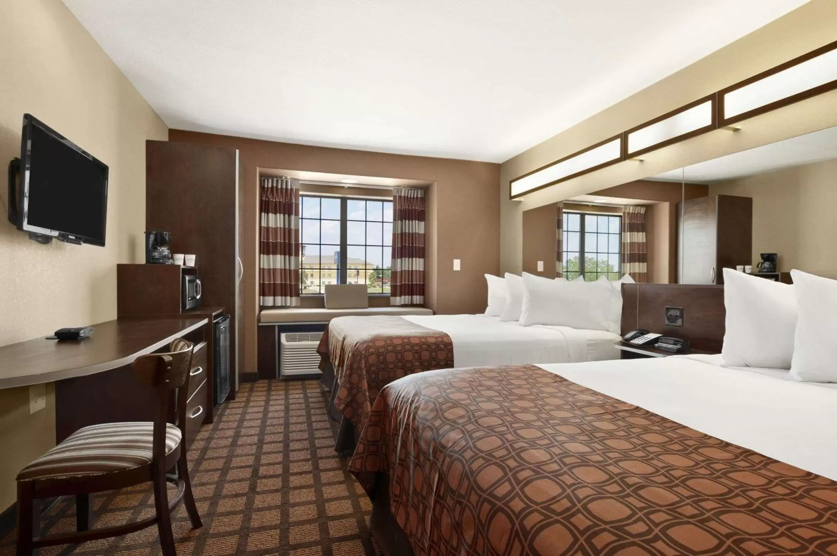 Bedroom in Microtel Inn & Suites Gonzales TX