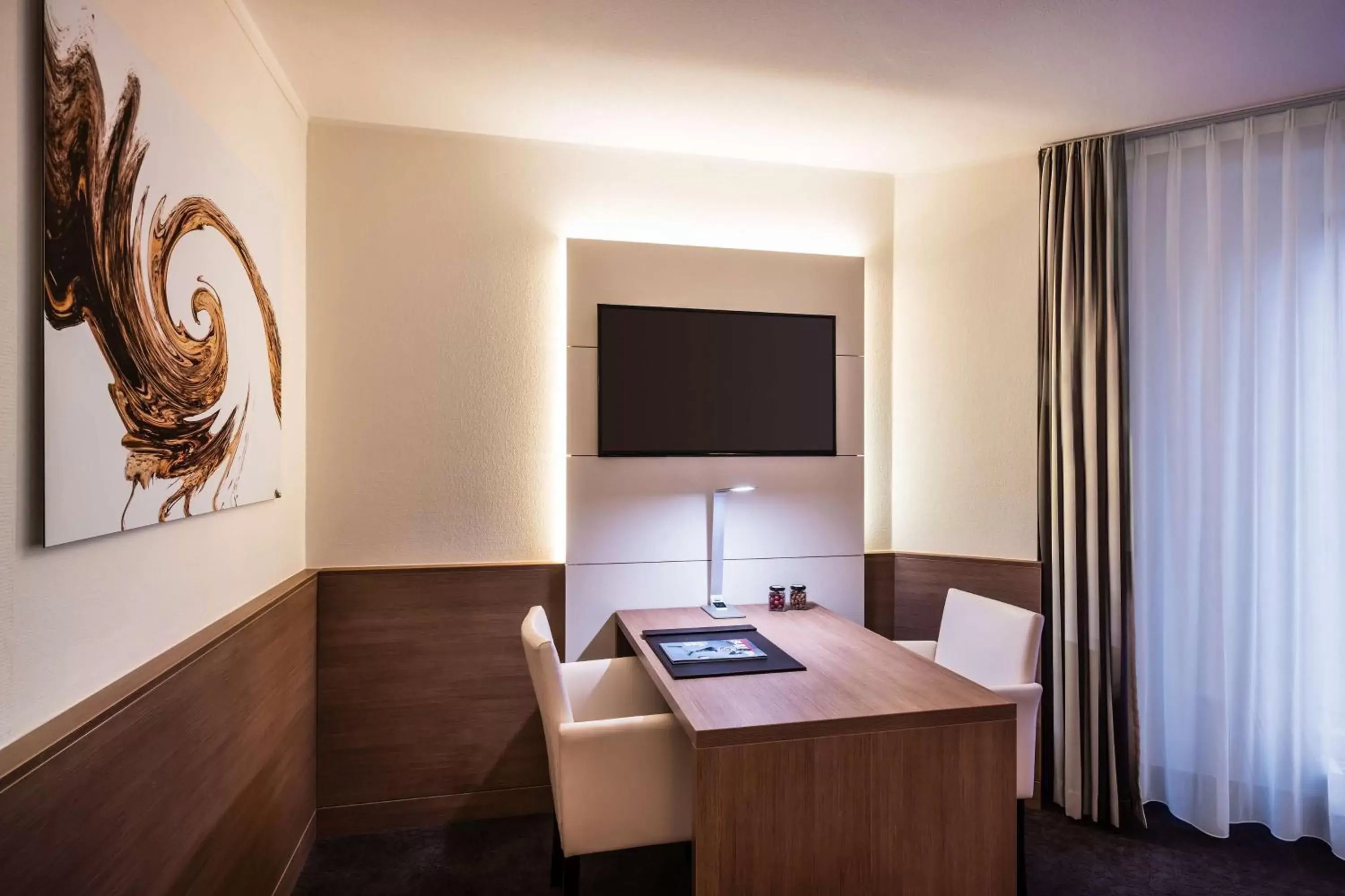 Photo of the whole room, TV/Entertainment Center in Lindner Hotel Dusseldorf Airport