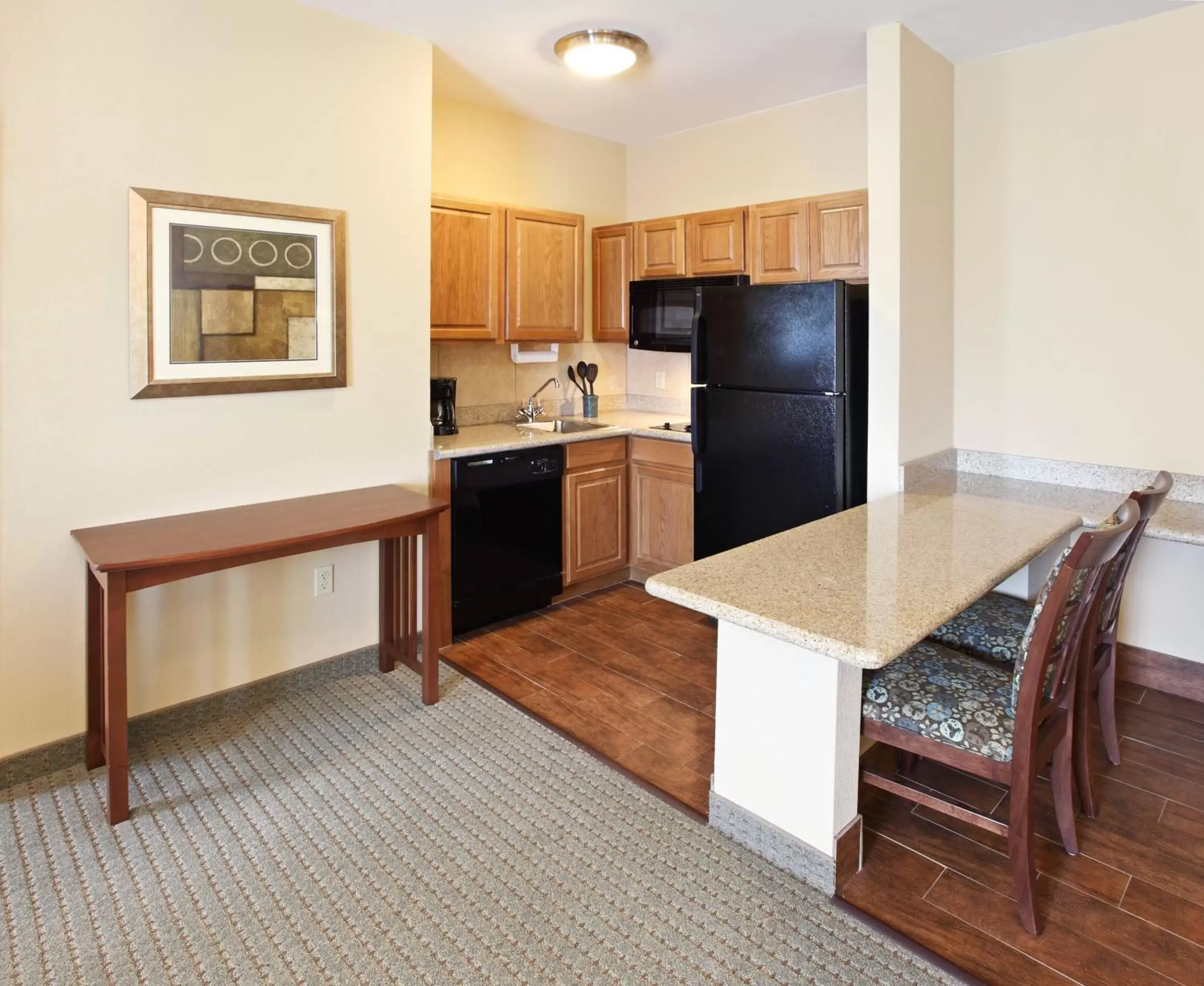 Photo of the whole room, Kitchen/Kitchenette in Staybridge Suites Rogers - Bentonville, an IHG Hotel