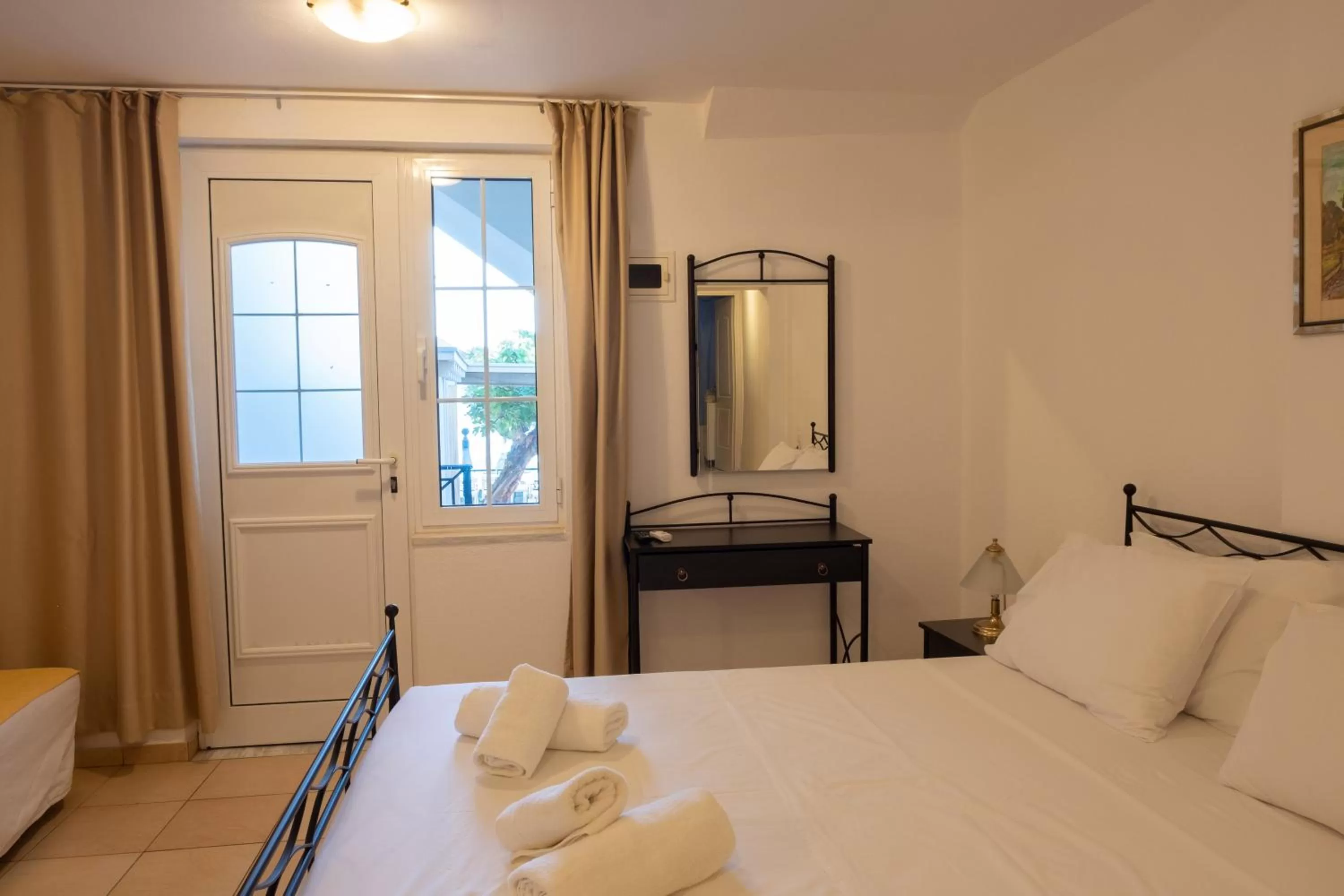 Bed in Polydoros Appartments