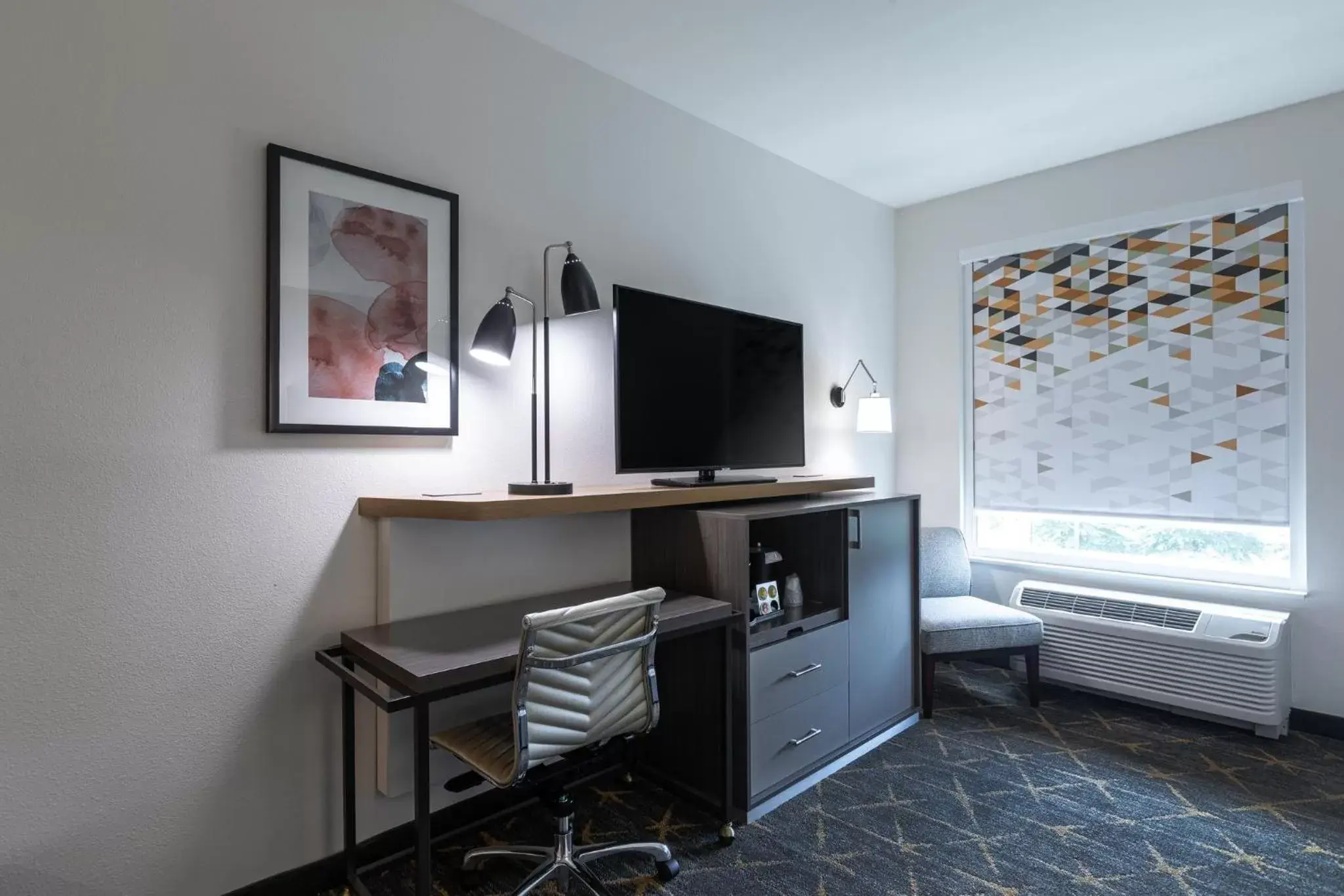 Photo of the whole room, TV/Entertainment Center in Holiday Inn Greenville - Woodruff Road, an IHG Hotel