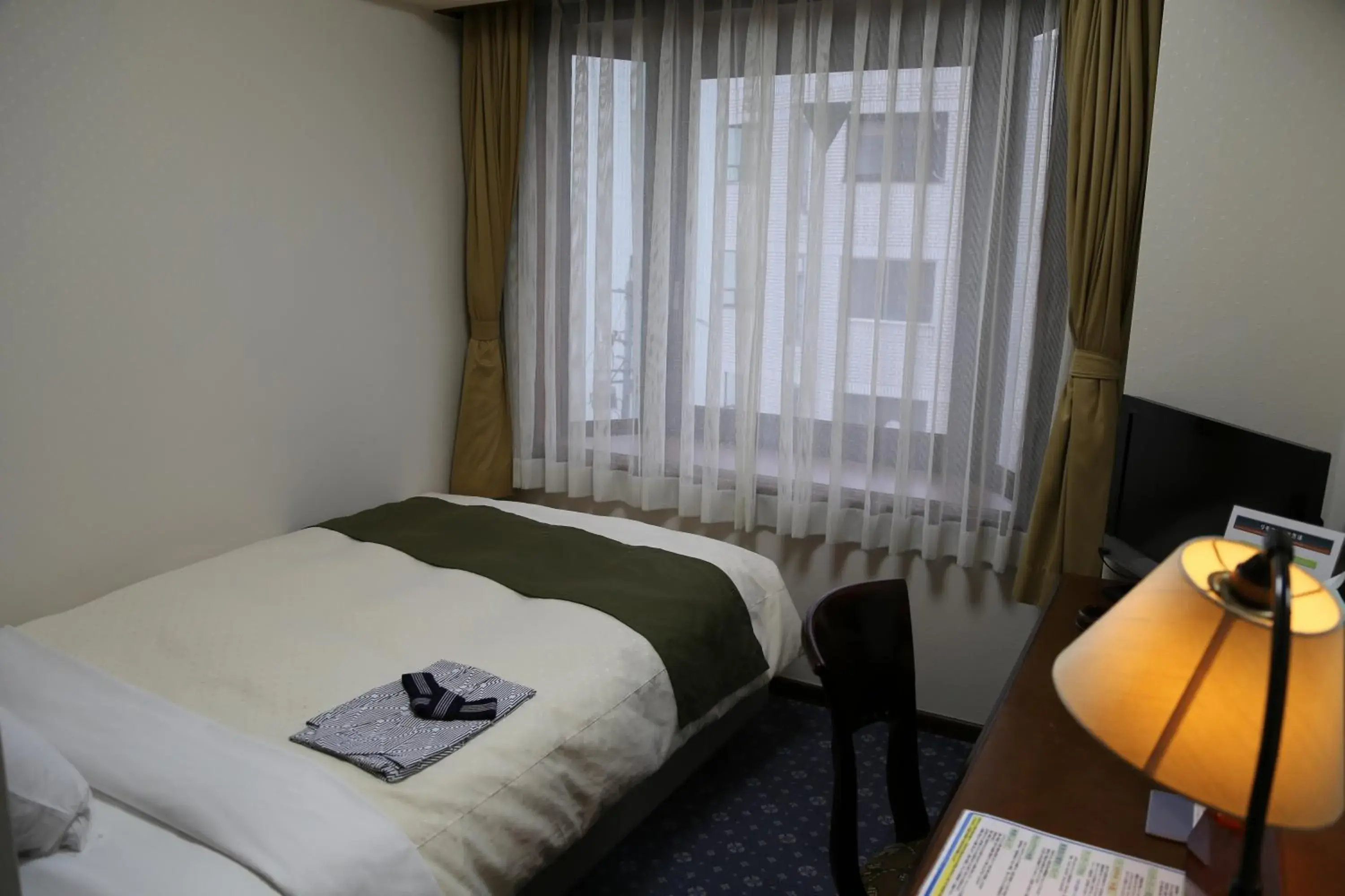 Photo of the whole room, Bed in Hotel New Station