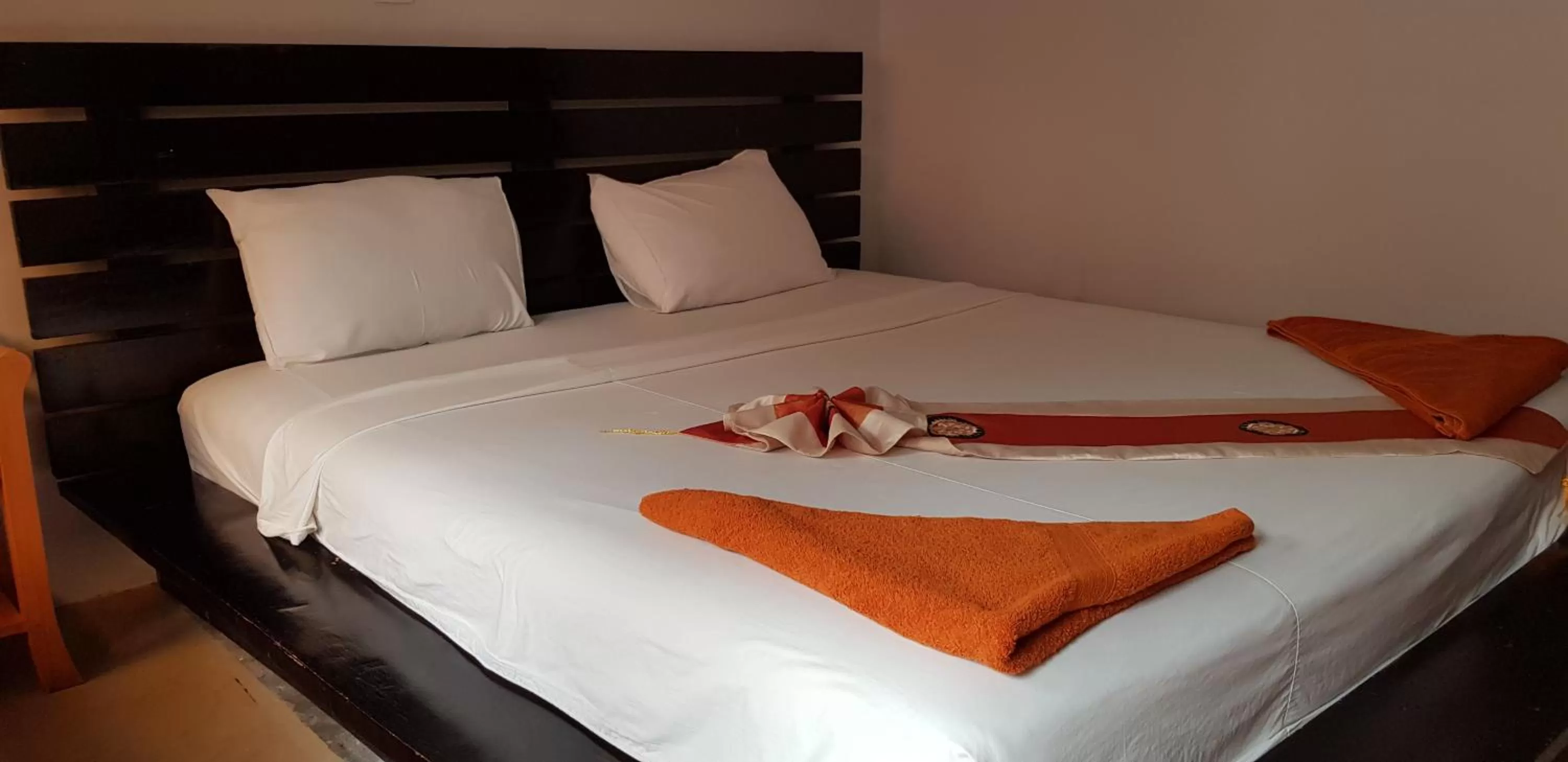 Bed in Apex Koh Kong Hotel