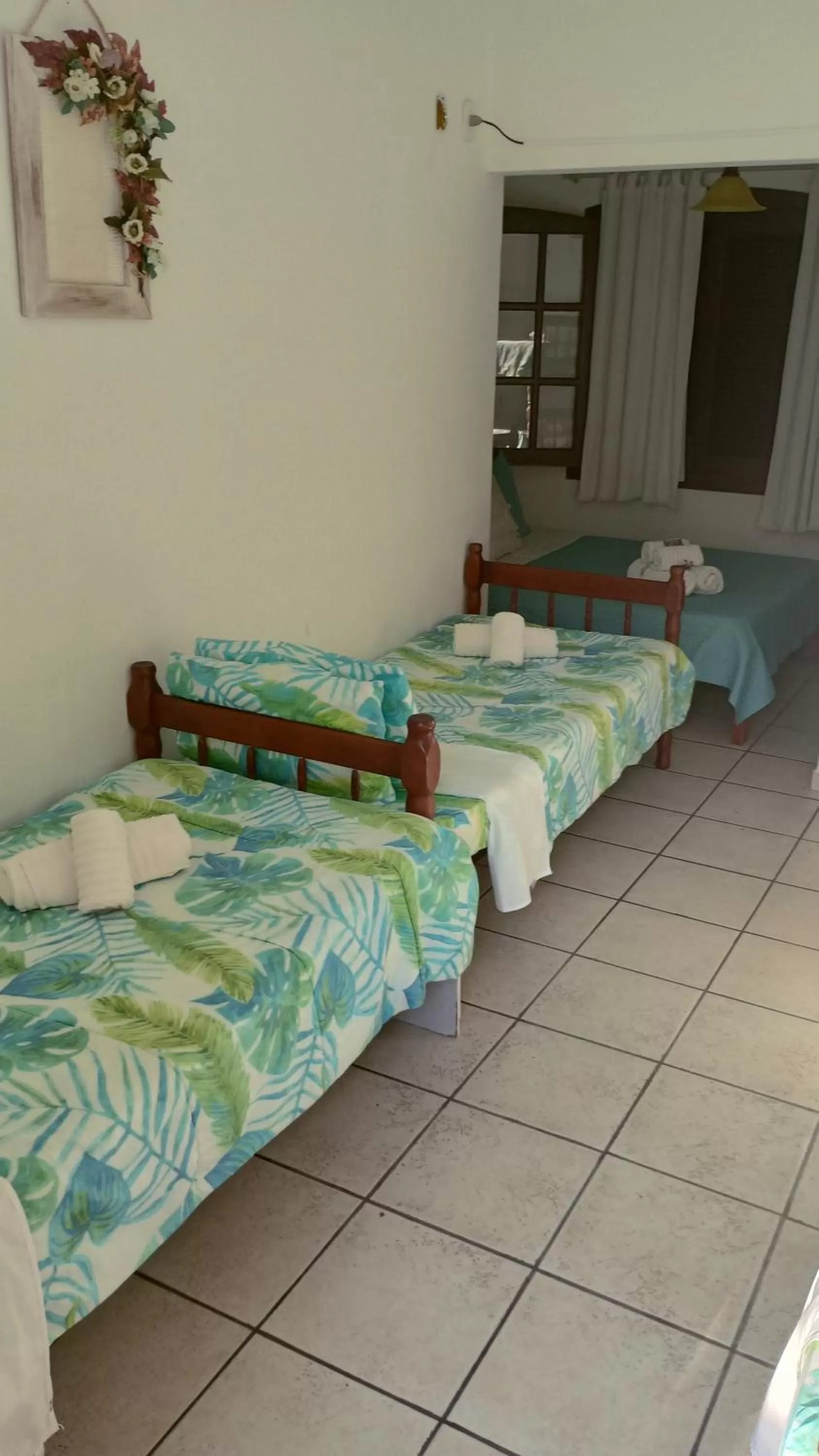 Bed in Hibiscos Pousada