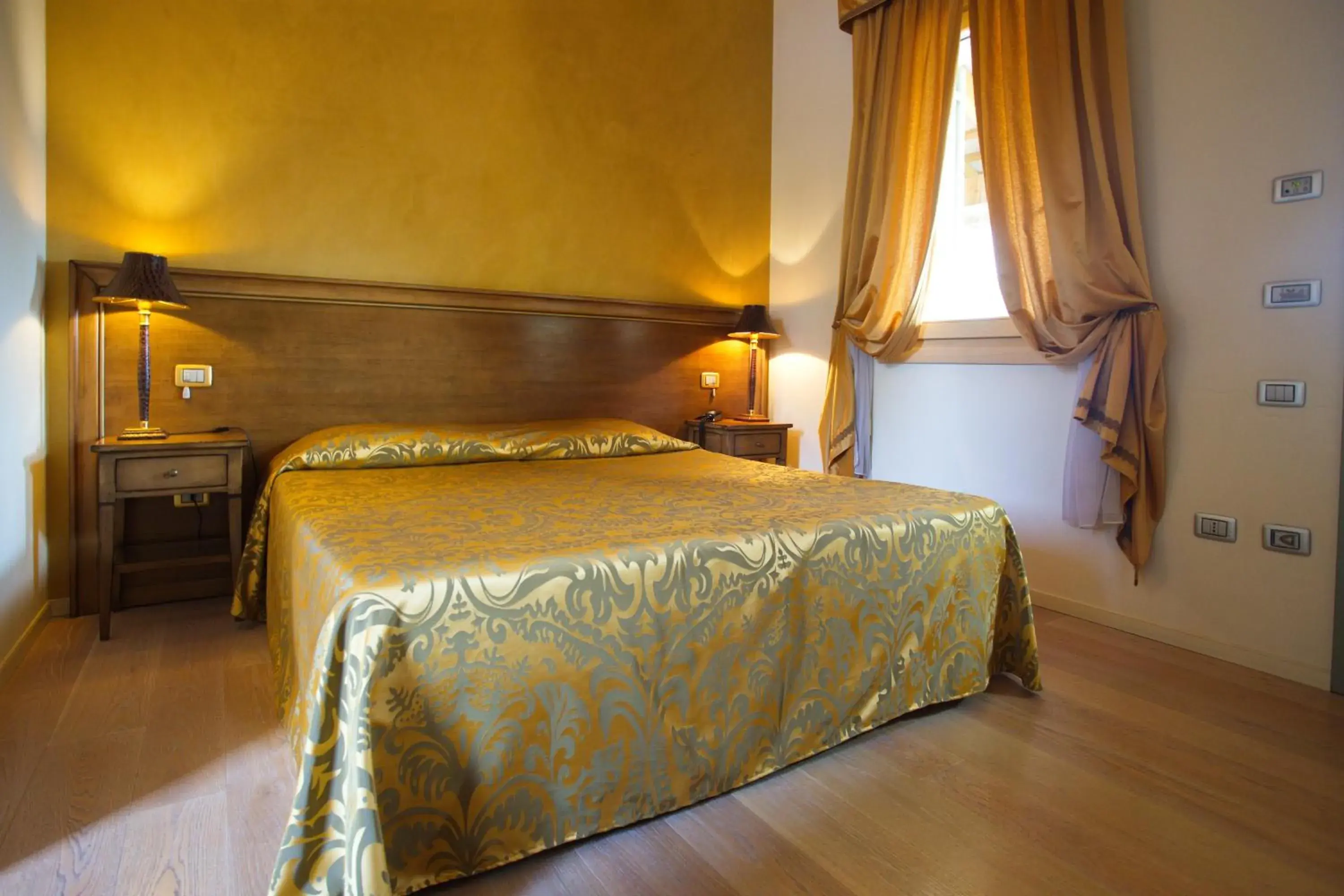 Bed in Hotel Asolo