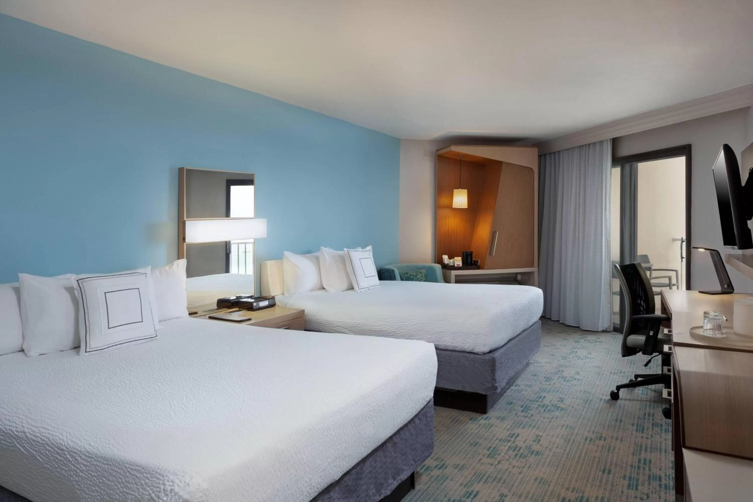 Queen Room with Two Queen Beds, Balcony and Partial Ocean View - Hearing Accessible in Courtyard by Marriott Isla Verde Beach Resort