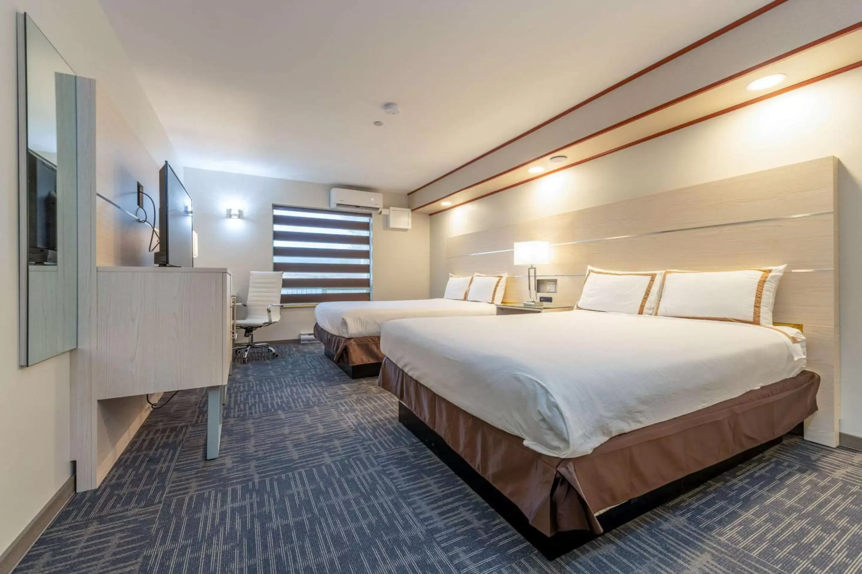 Bedroom, Bed in Quality Inn Sunshine Suites