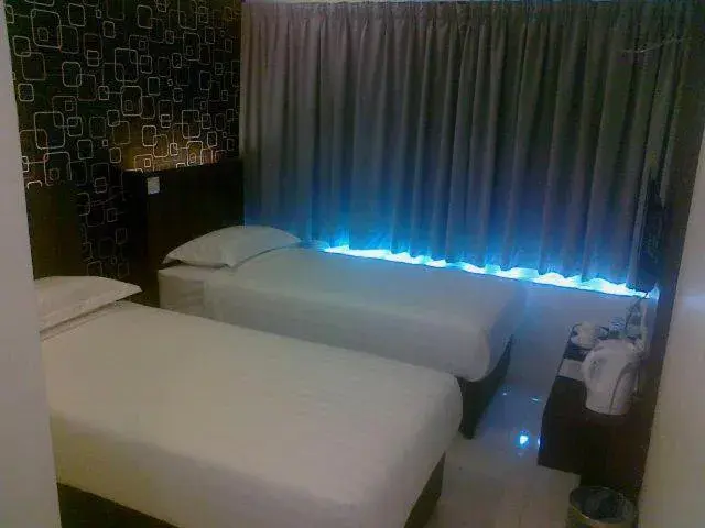 Bed in The Regency Garden Hotel
