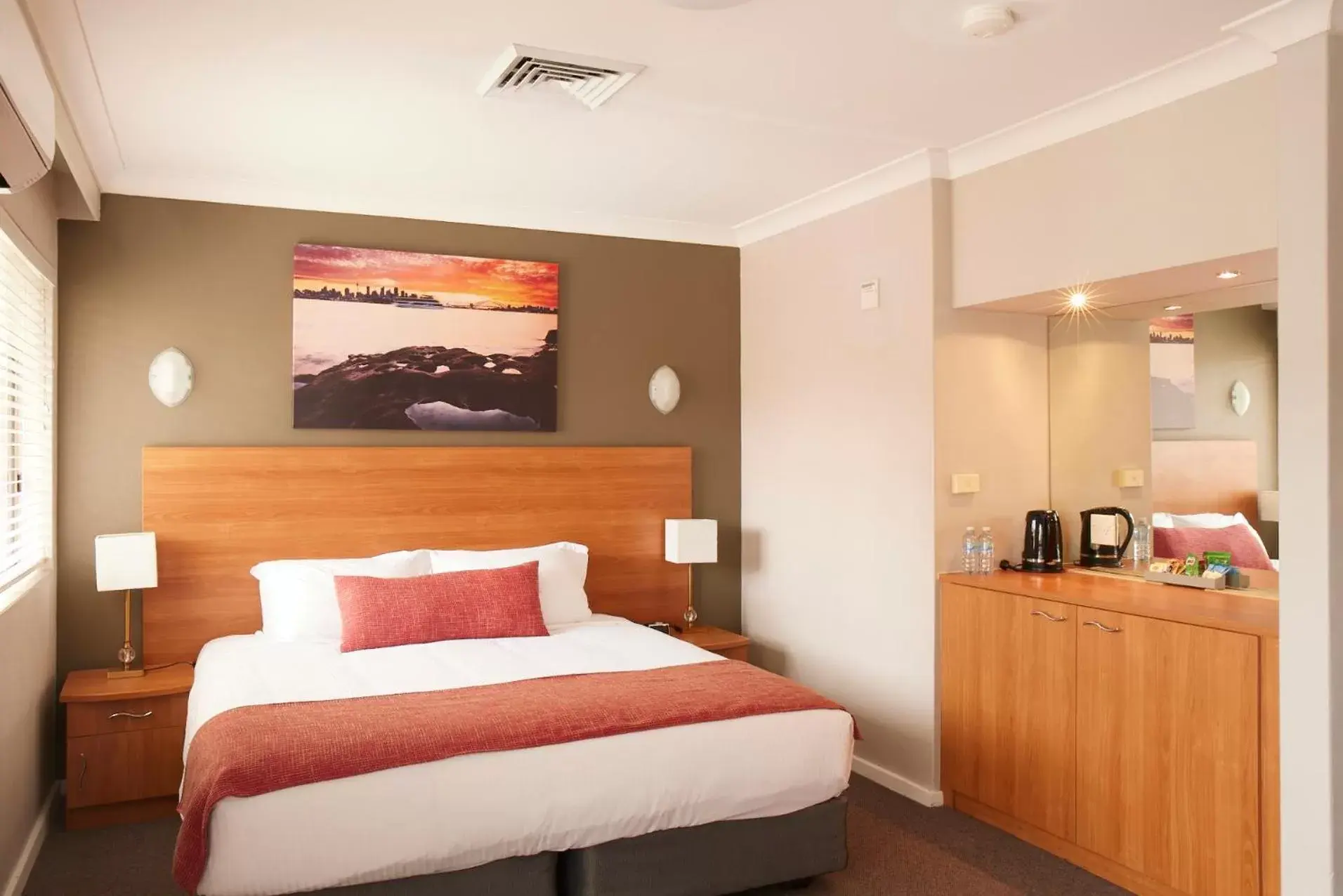 Communal lounge/ TV room, Bed in Ramada Hotel & Suites by Wyndham Cabramatta