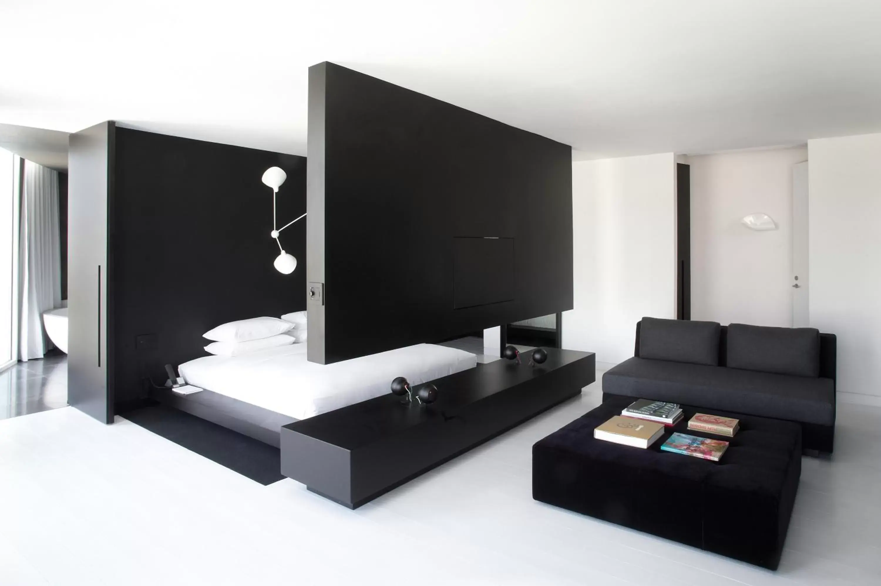 Bedroom, TV/Entertainment Center in Habita Monterrey, a Member of Design Hotels