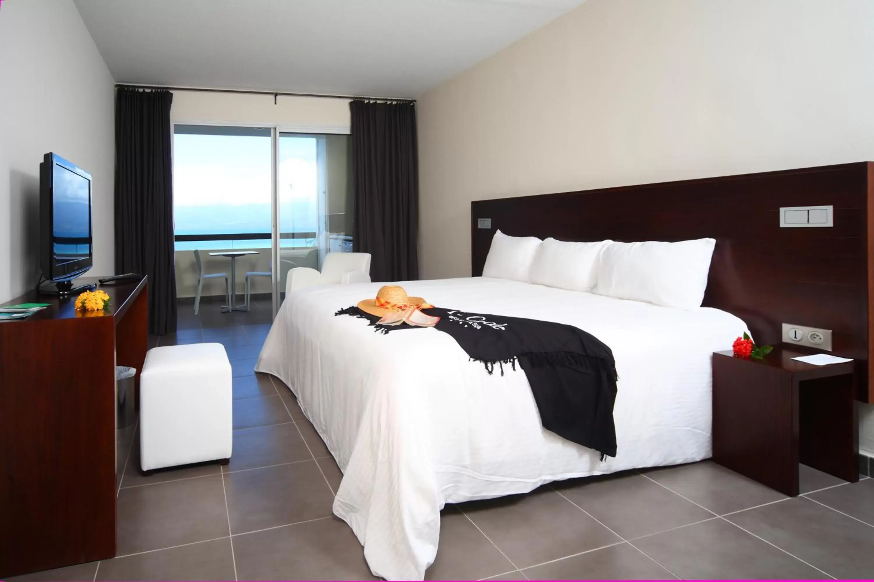 Bedroom in Mahogany Hotel Residence & Spa