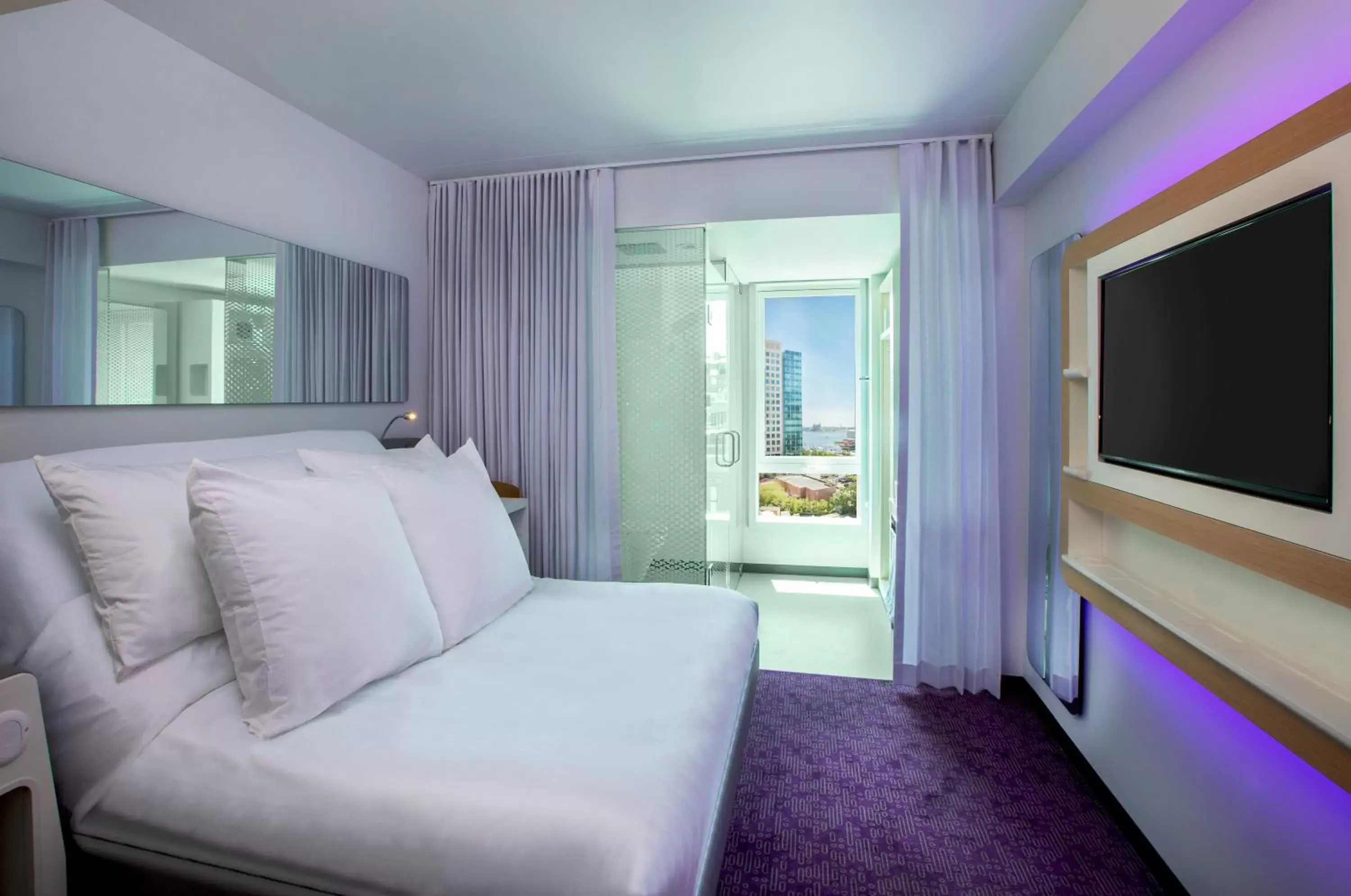 Photo of the whole room, Bed in YOTEL Boston