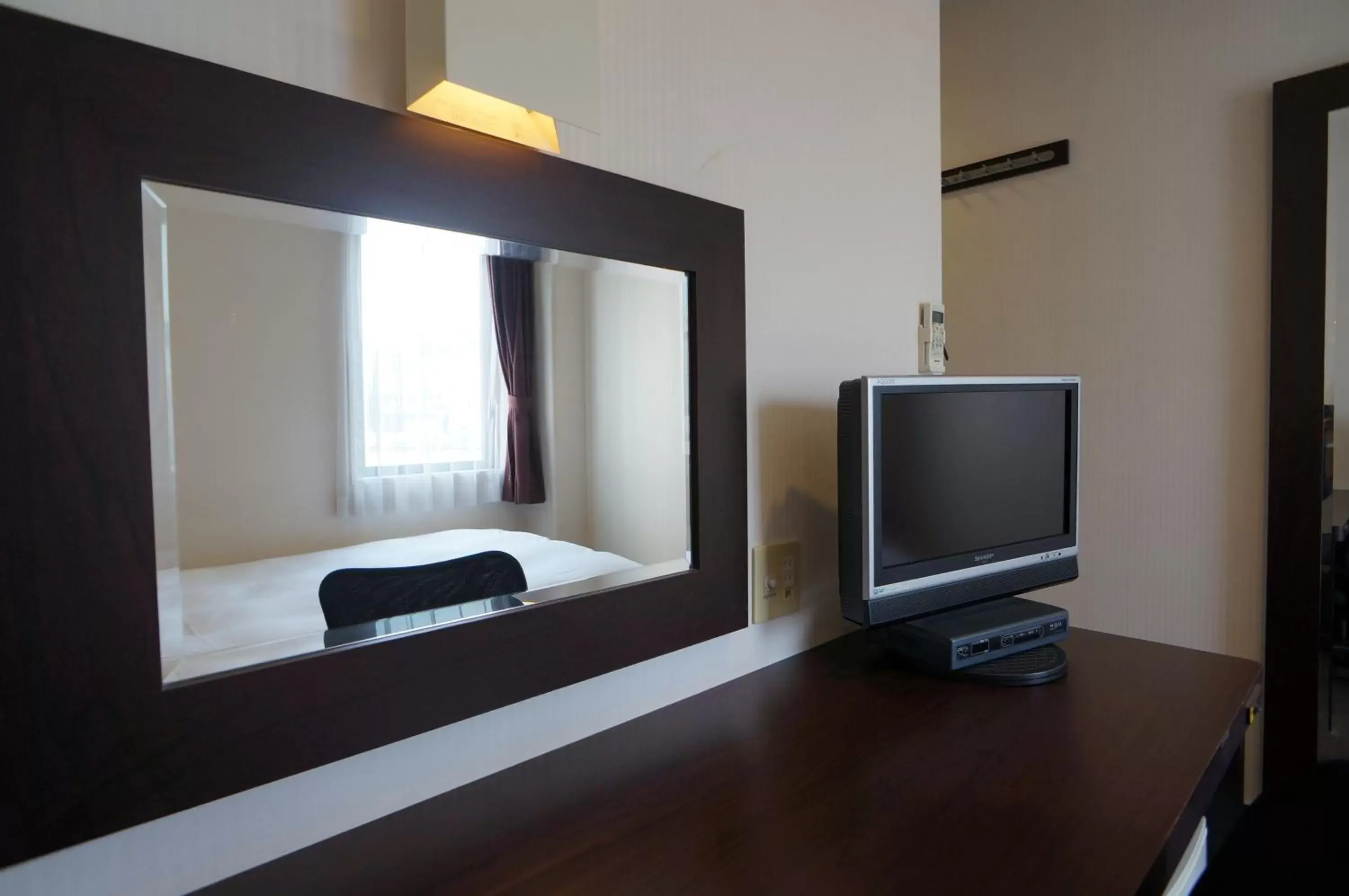 Photo of the whole room, TV/Entertainment Center in Green Rich Hotel Hiroshima Shinkansenguchi (Artificial hot spring Futamata Yunohana)