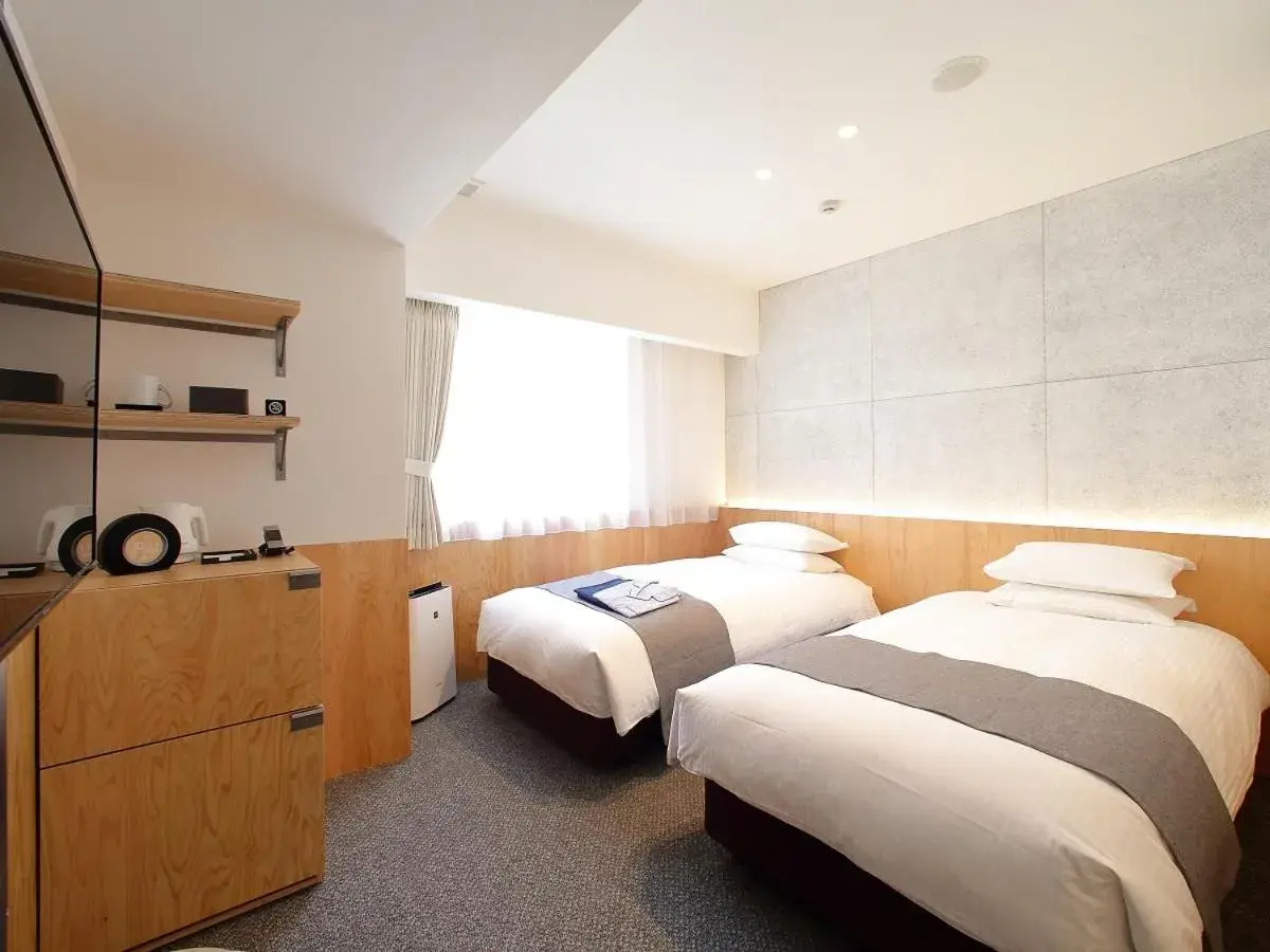 Bed in Hotel Oriental Express Tokyo Kamata