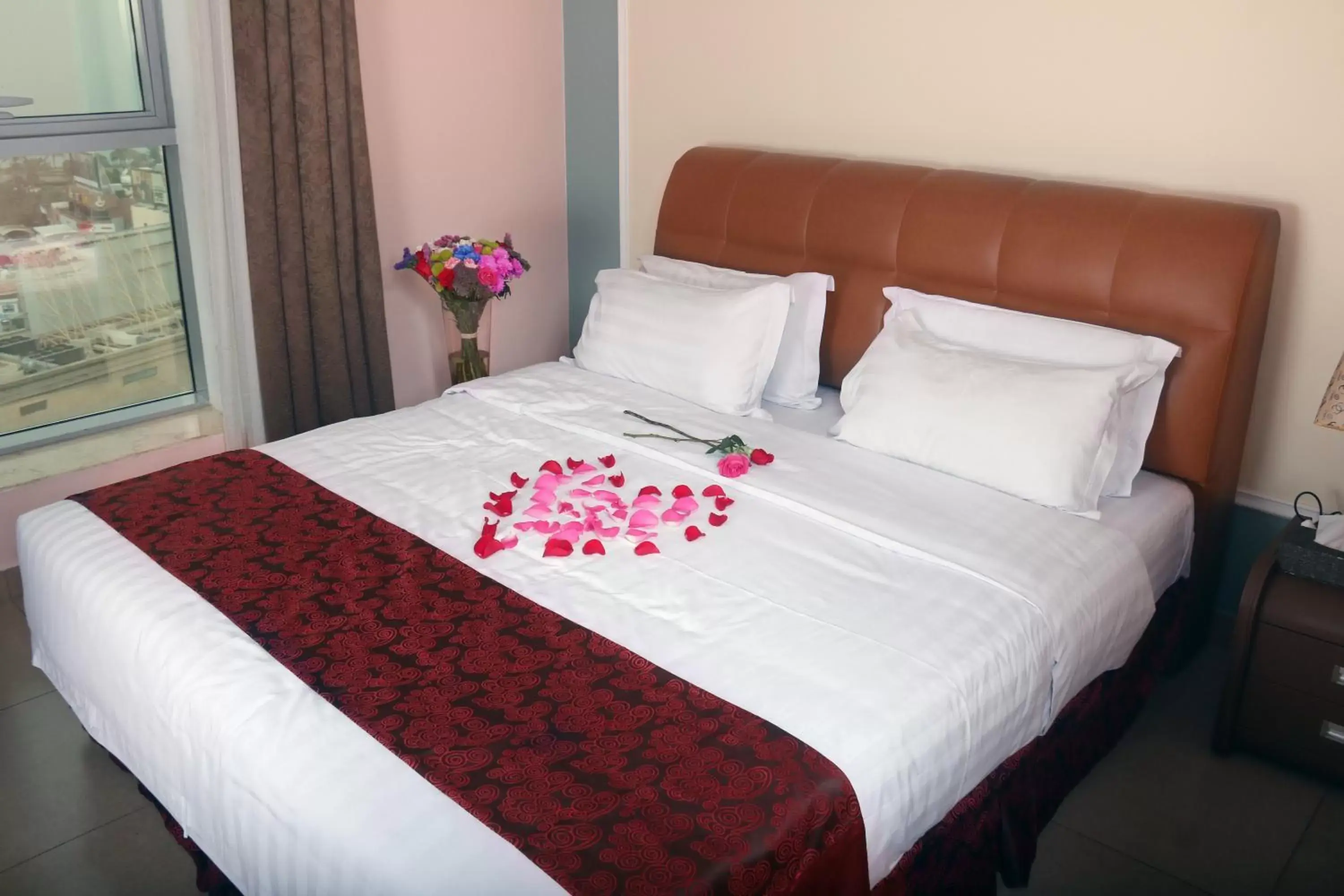 Bed in Laguna Hotel Suites