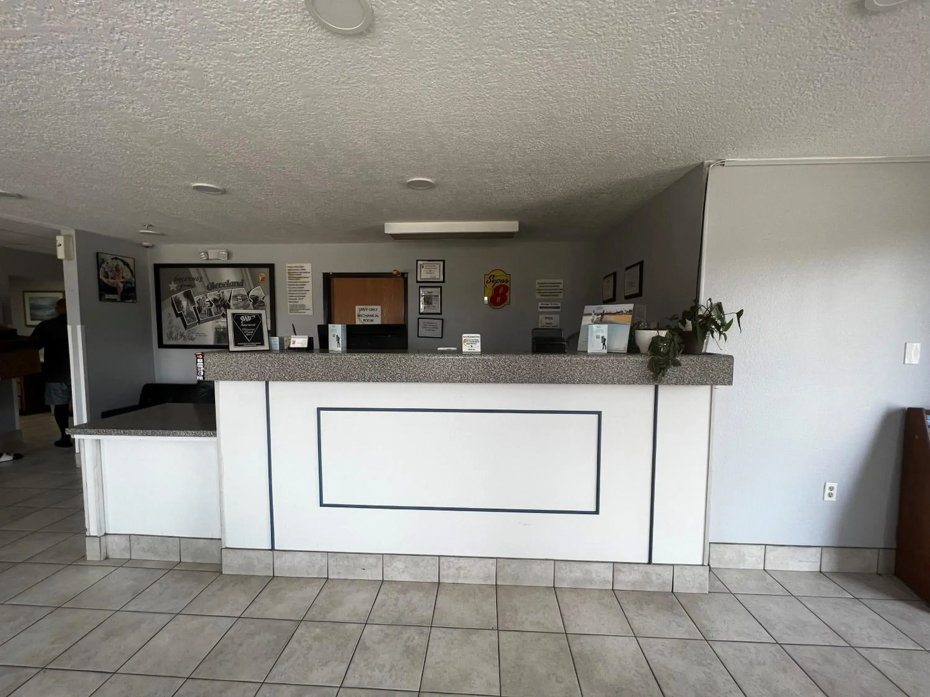Lobby or reception in Super 8 by Wyndham Cleveland TX Lobby or reception in Super 8 by Wyndham Cleveland TX
