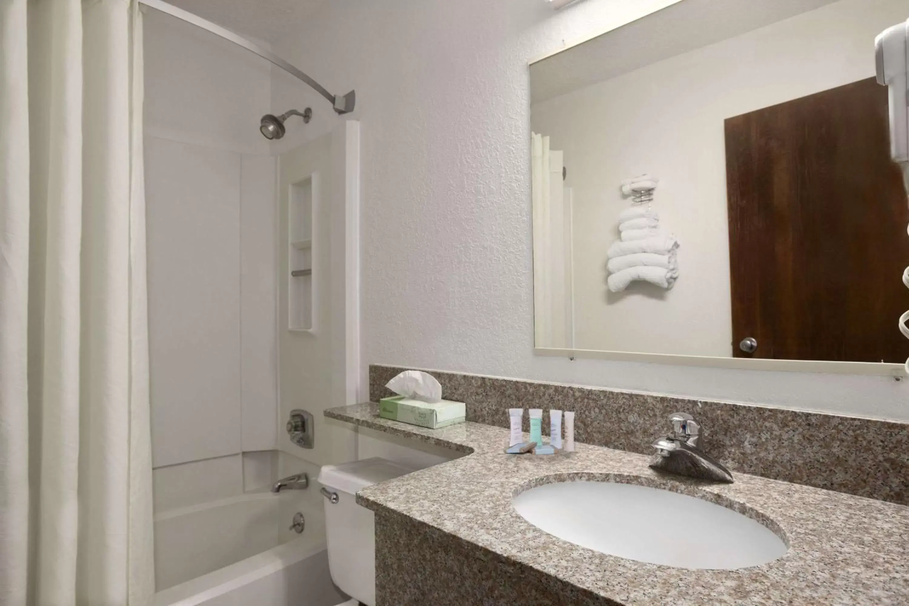 Bathroom in Travelodge by Wyndham Muskegon