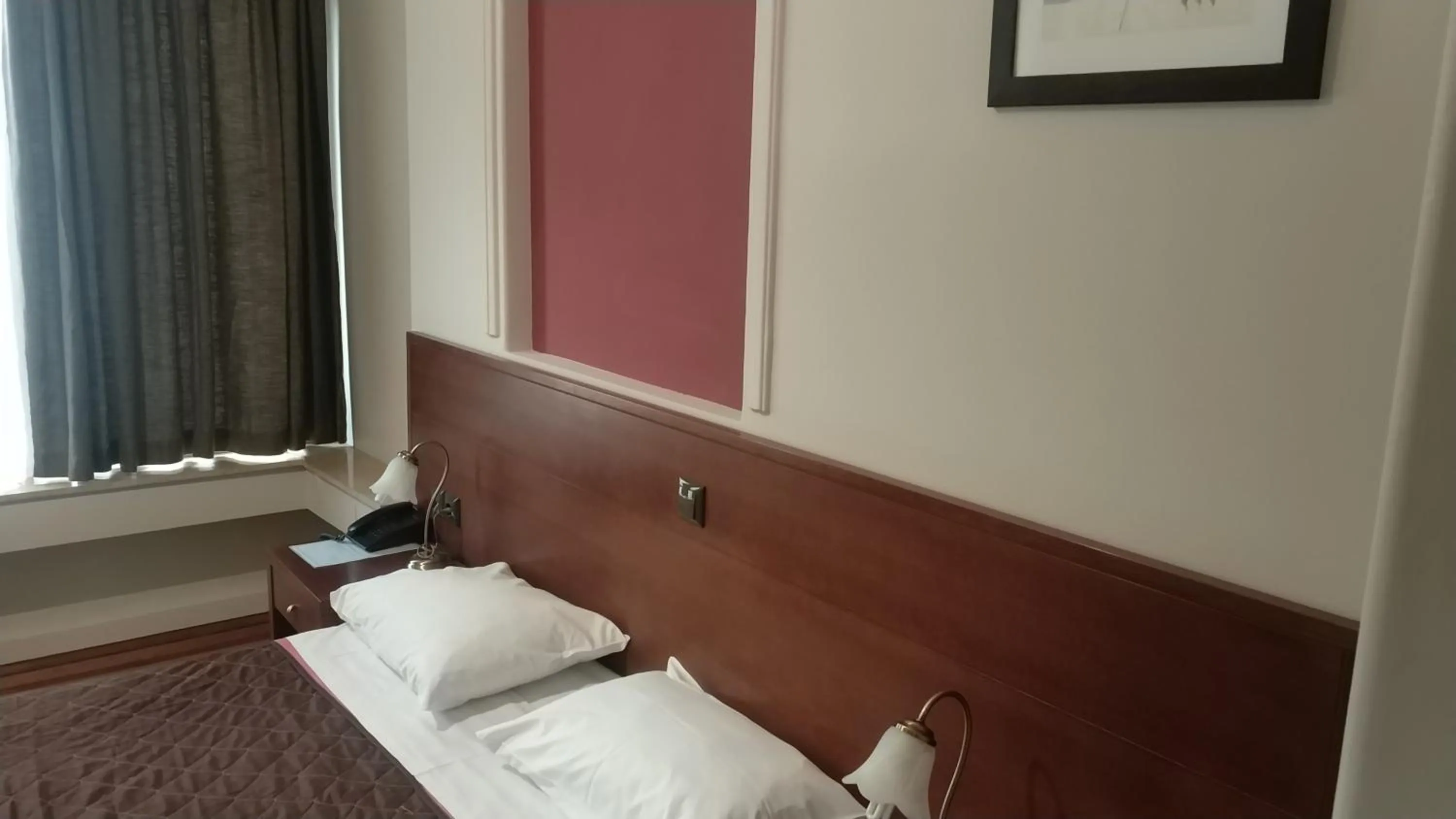 Bed in Ambrosia Suites