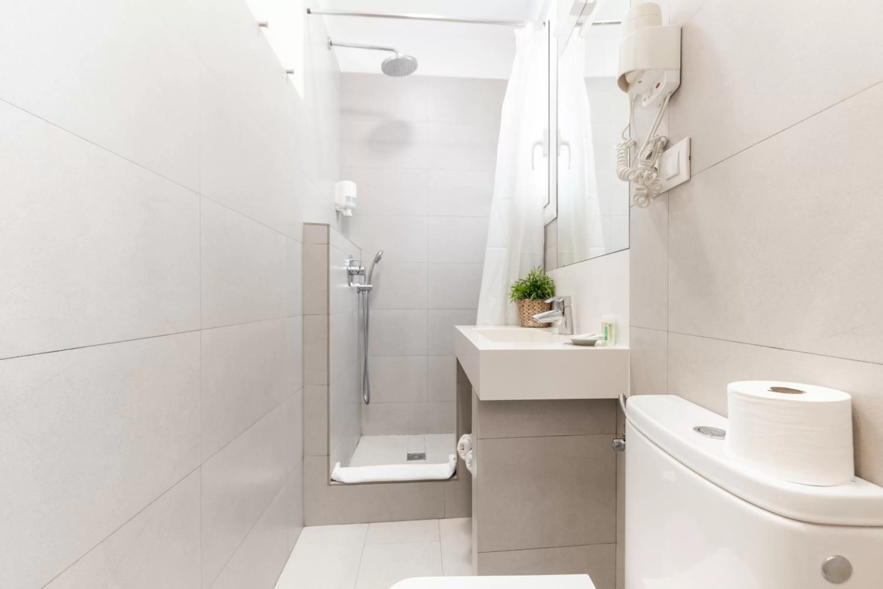 Bathroom in Atica Apartments - by Weflating