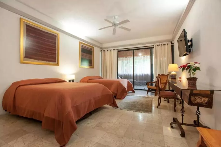 Bed in Orchidelirium Casa Hotel & Salud Estética