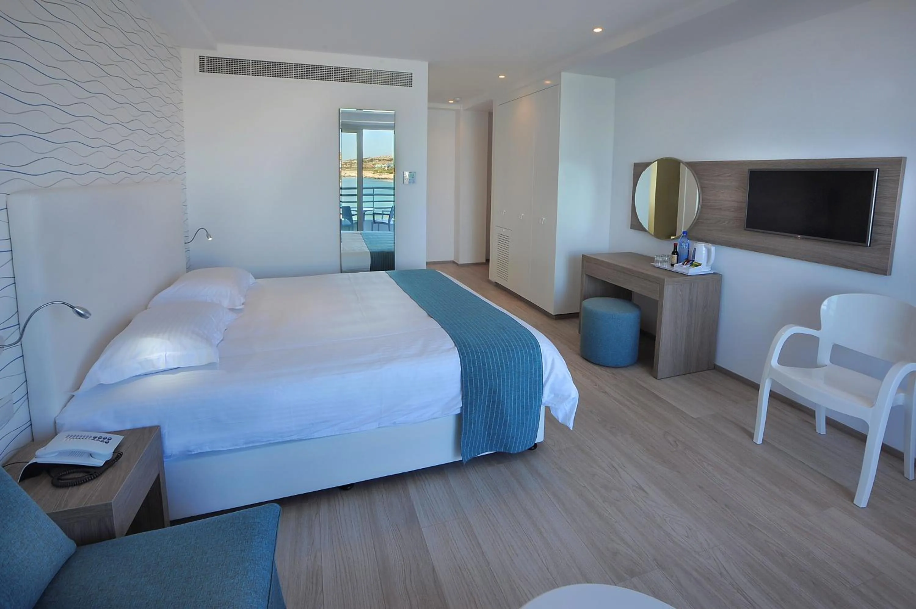 Bed in Okeanos Beach Boutique Hotel