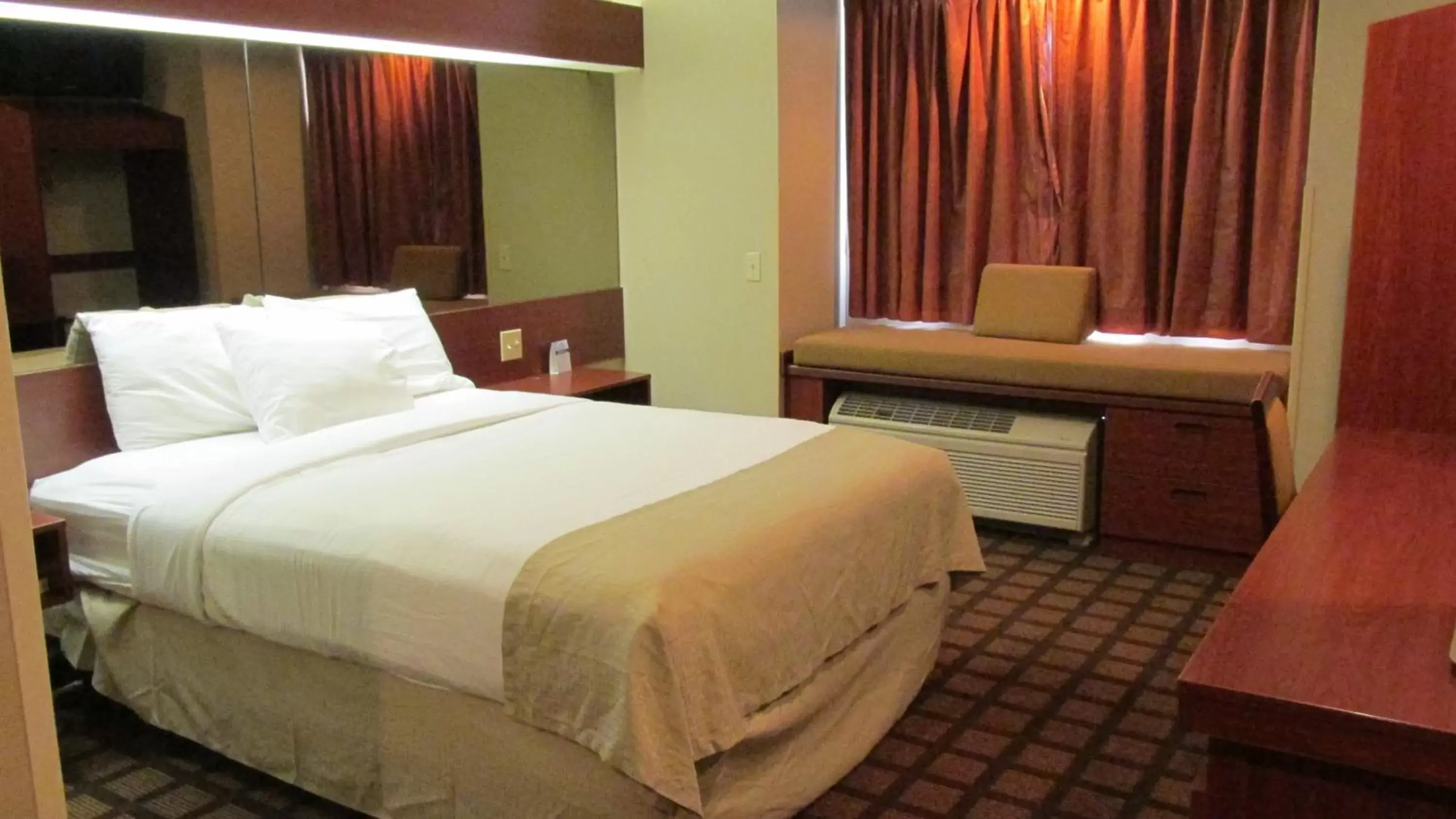 Bed in Microtel Inn & Suites by Wyndham Rapid City