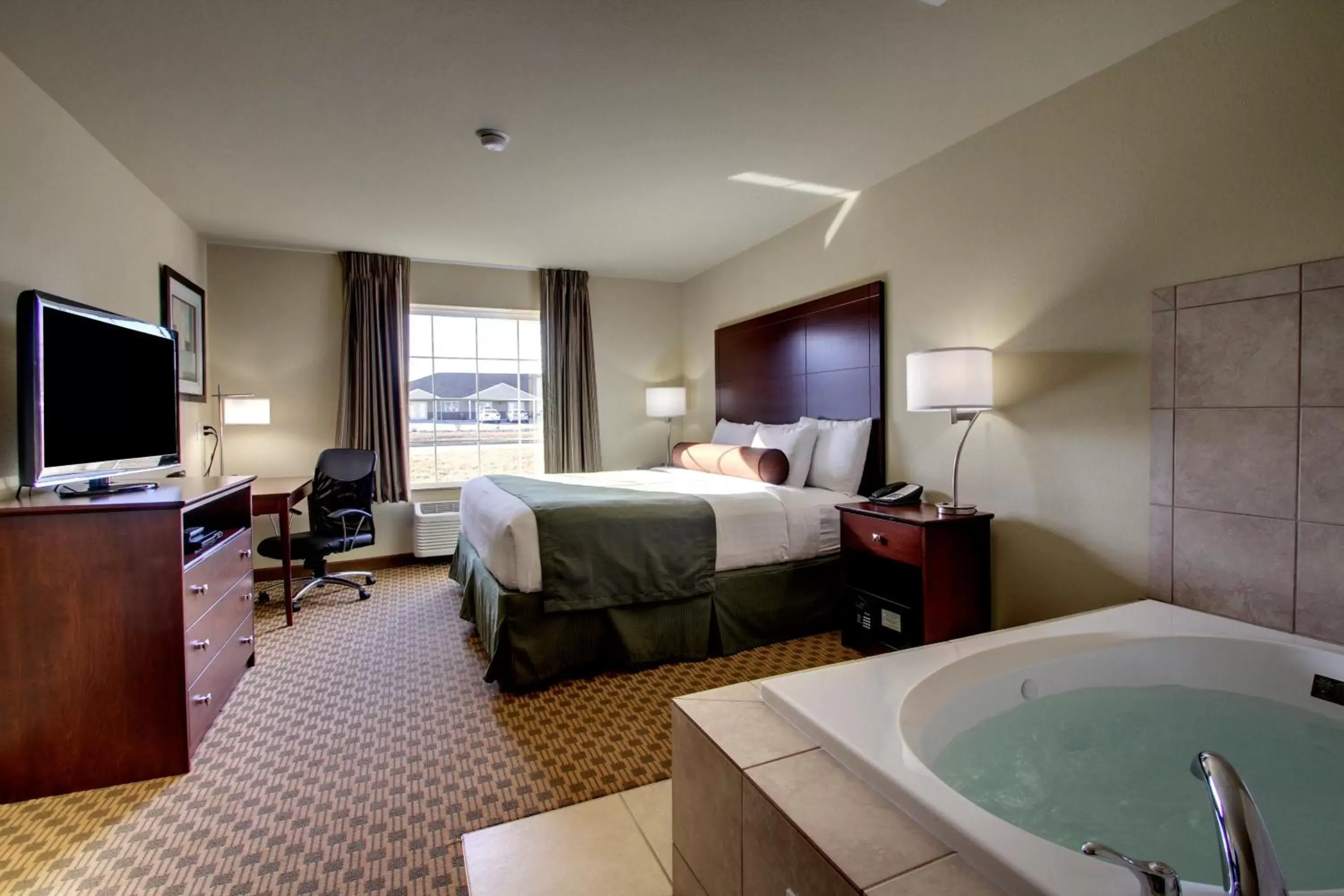 Bedroom in Cobblestone Inn & Suites - Rugby