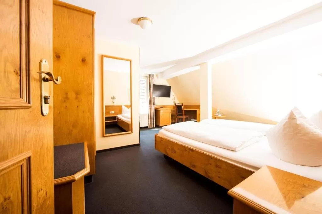 Photo of the whole room, Bed in Stadthotel Waldhorn