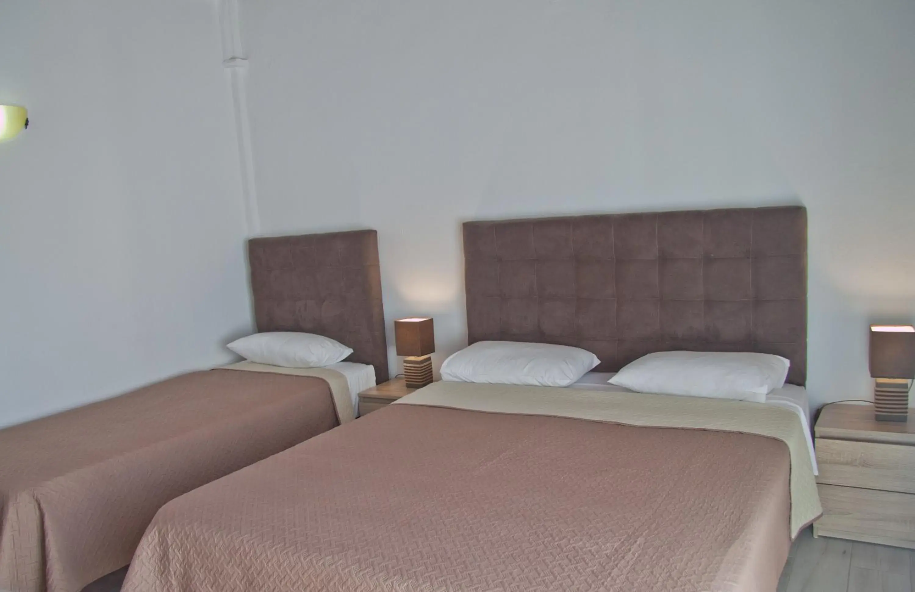 Bed in Danaos Hotel