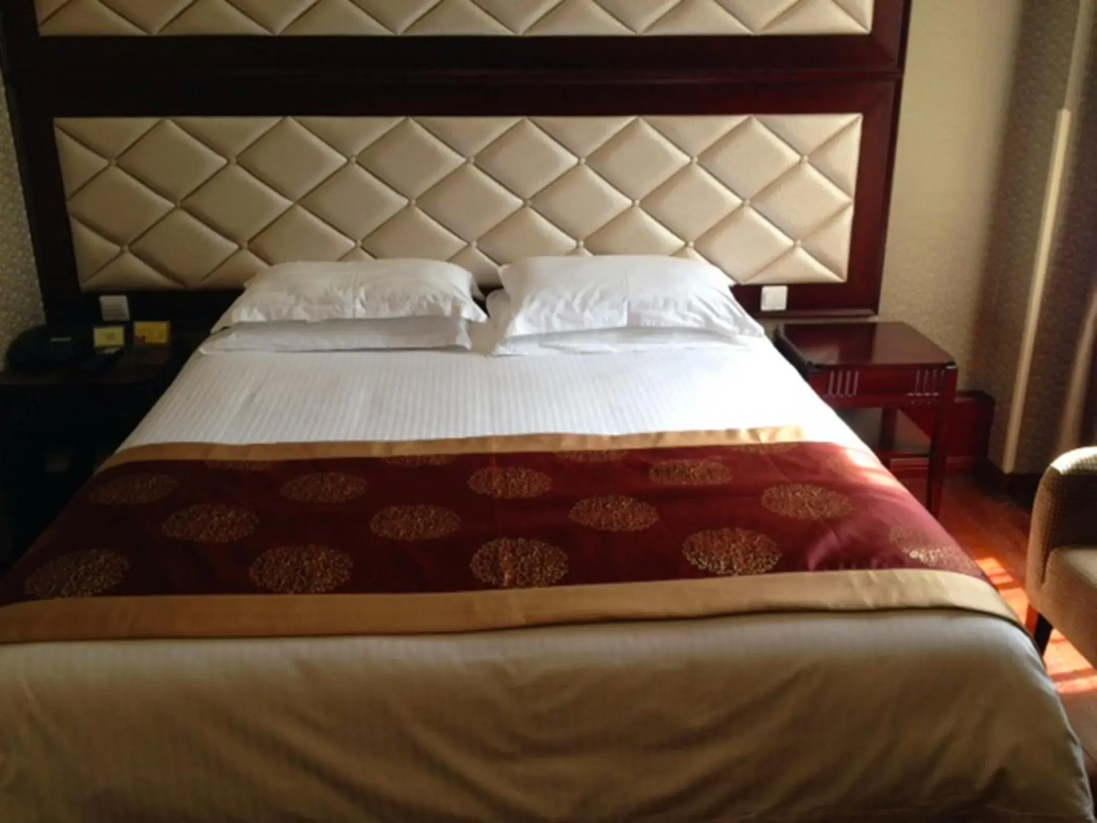 Bed in Seventh Heaven Hotel