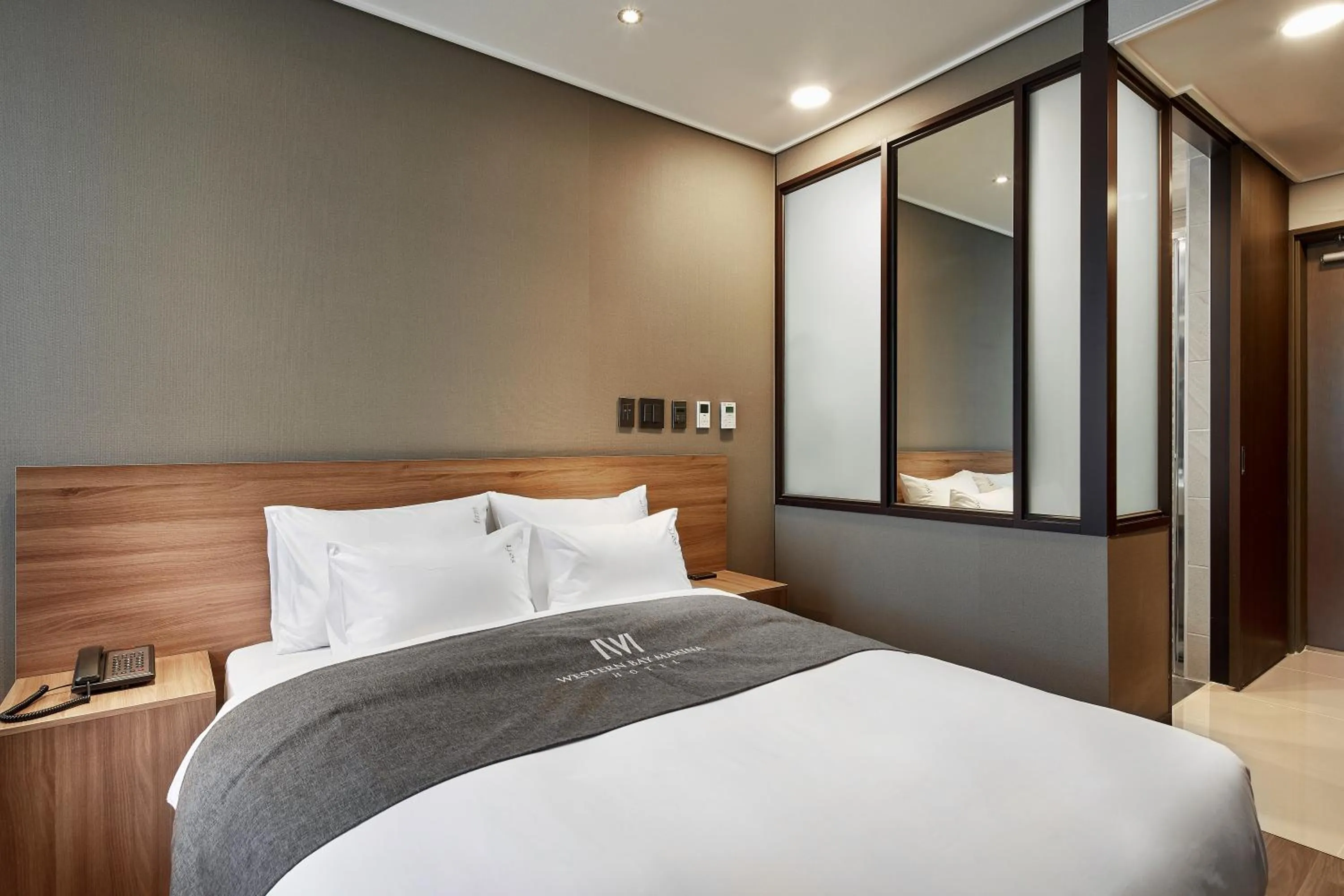 Bed in Western Bay Marina Hotel