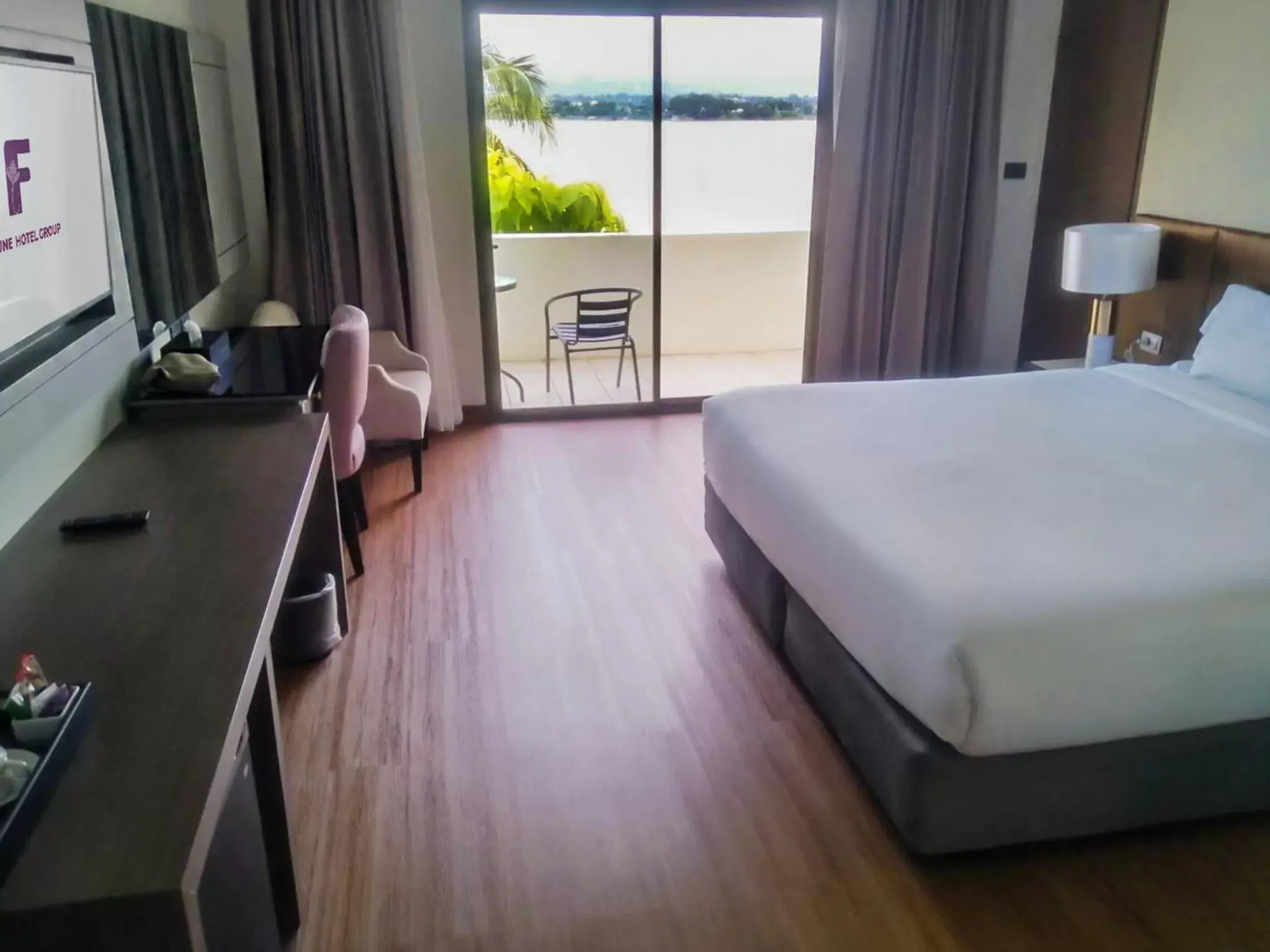 Balcony/Terrace, Bed in Fortune River View Hotel Nakhon Phanom