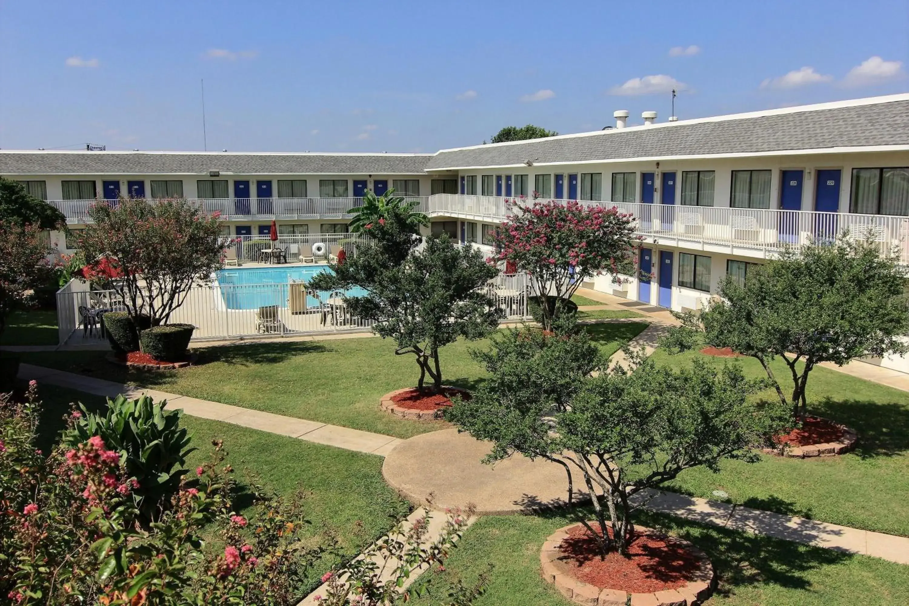 Facade/entrance, Pool View in Motel 6-Austin, TX - North