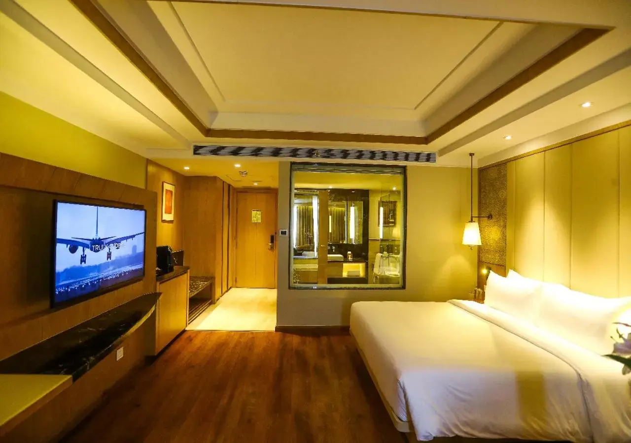 Bedroom, TV/Entertainment Center in Radisson Bhopal