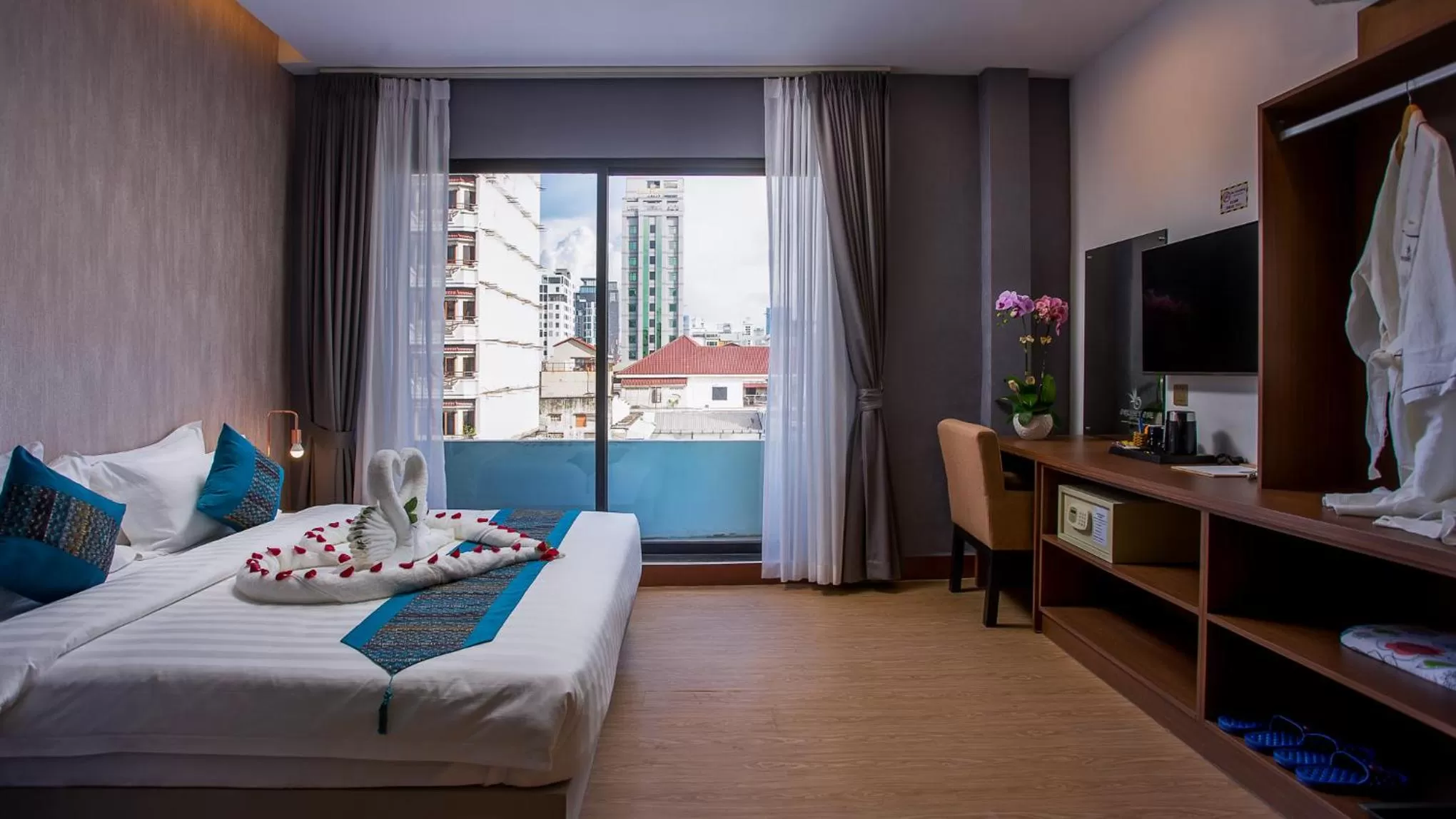 Photo of the whole room, Bed in Orussey One Boutique