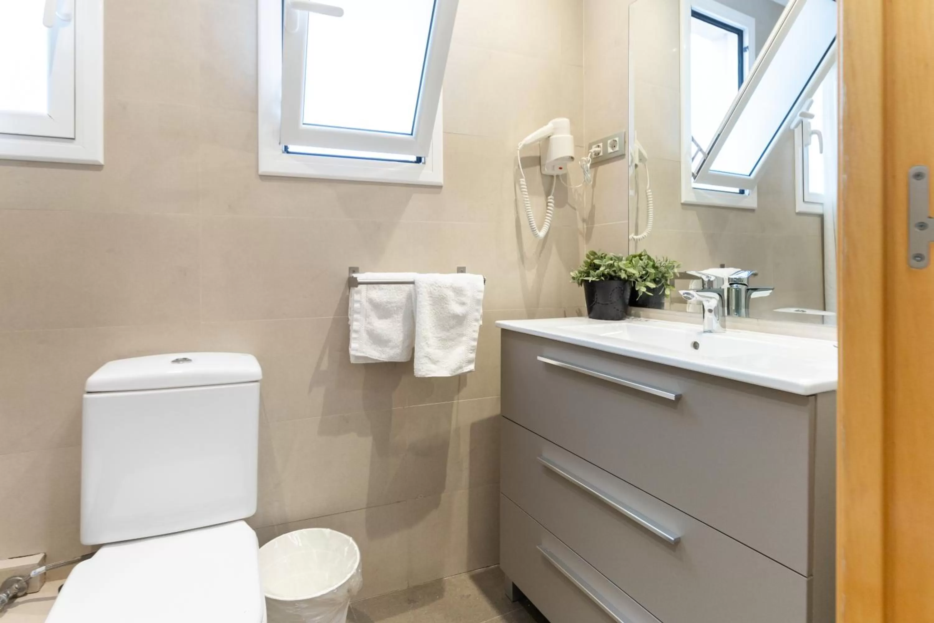 Toilet in Atica Apartments - by Weflating